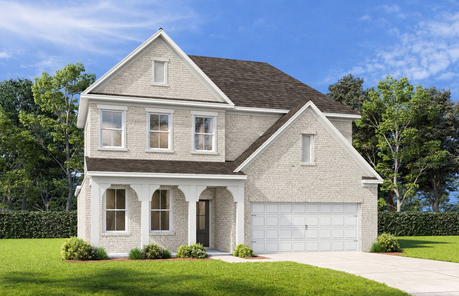 Craftsman-style exterior of The Ashport G featuring light brick, covered front porch, and a 2-car garage in Buford, GA.
