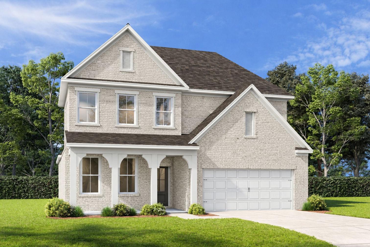 Craftsman-style exterior of The Ashport G featuring light brick, covered front porch, and a 2-car garage in Buford, GA.