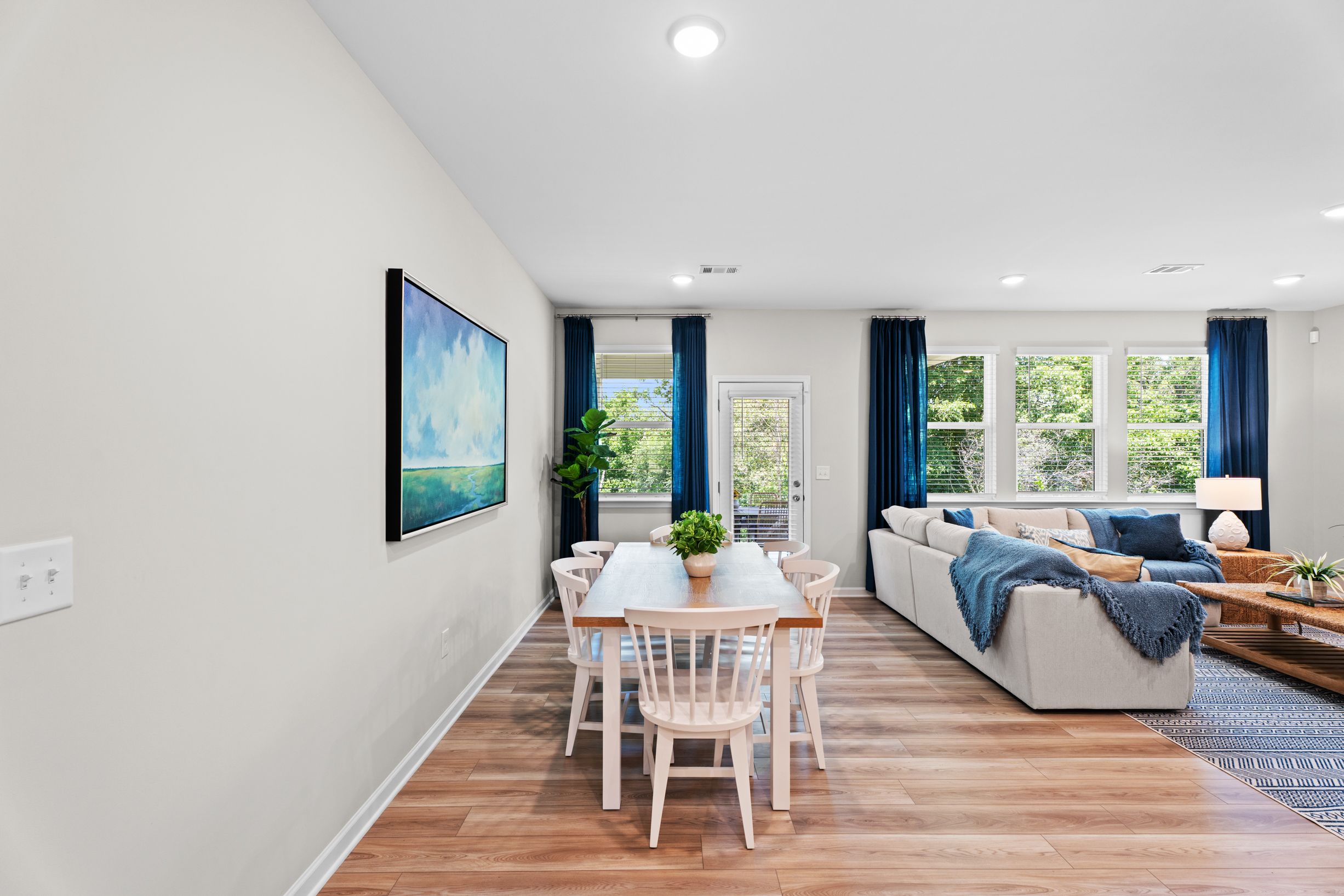 Dining room with wood table and white chairs