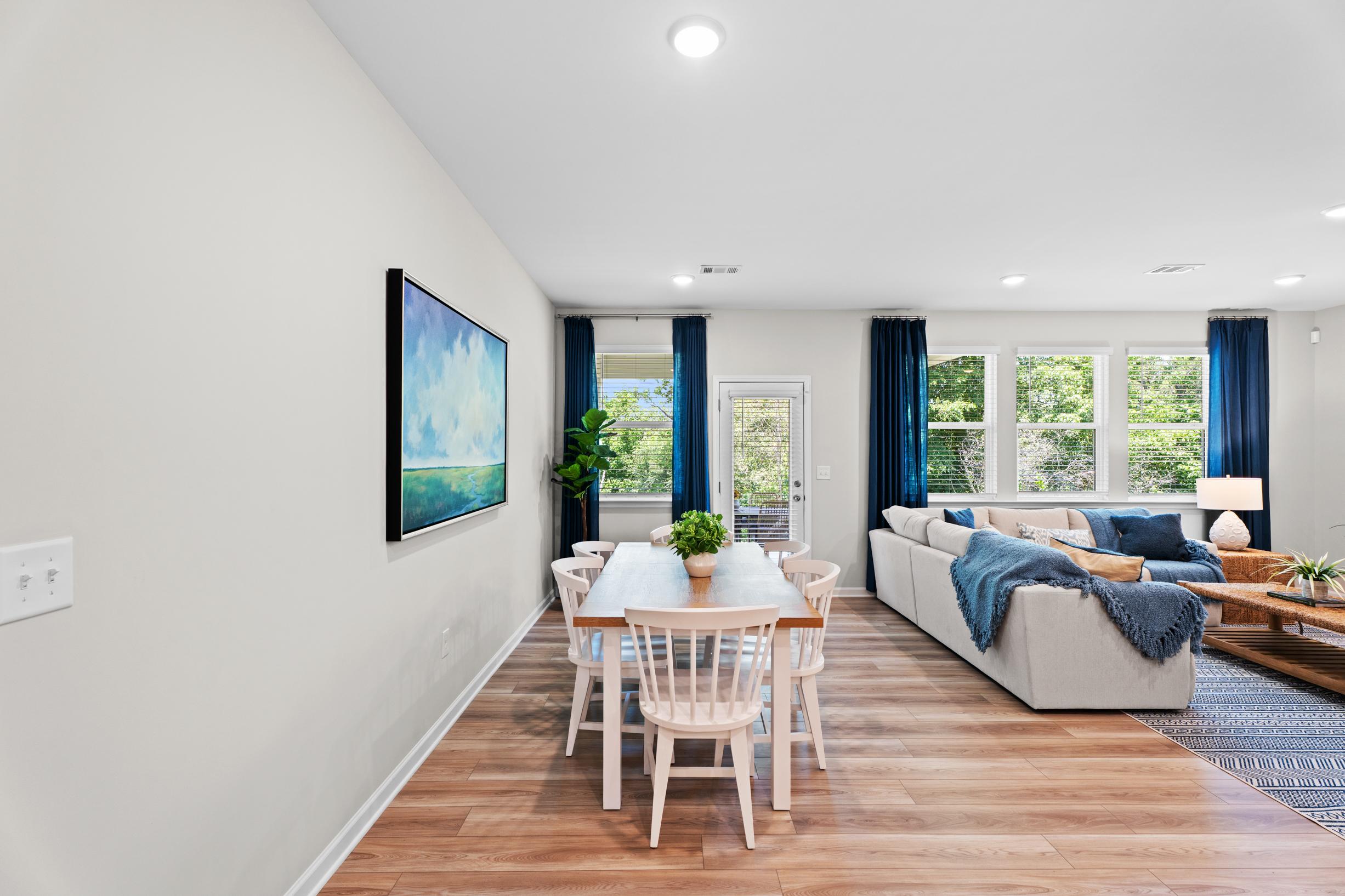 Dining room with wood table and white chairs