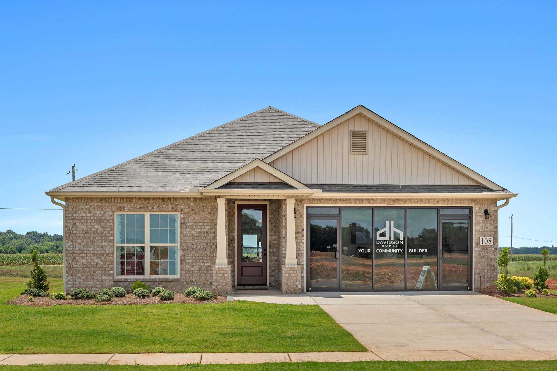 Contemporary ranch home exterior at Heritage Lakes in New Market AL by Davidson Homes with brick siding and covered porch