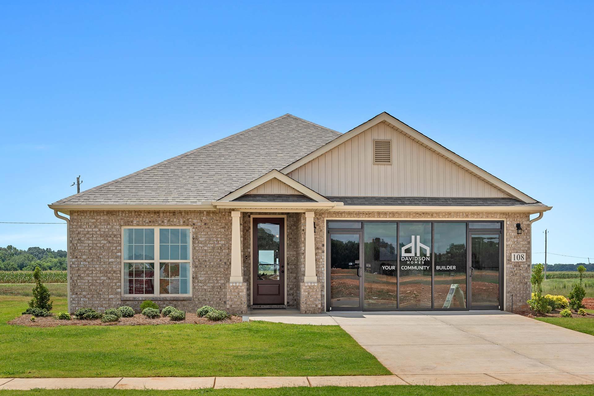 Contemporary ranch home exterior at Heritage Lakes in New Market AL by Davidson Homes with brick siding and covered porch