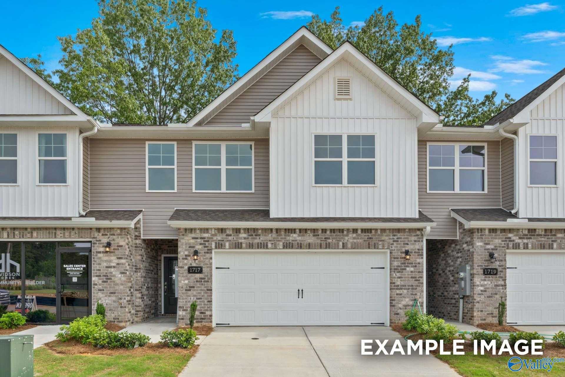 Modern two-story Camden B home exterior with brick accents, two-car garage, and lush landscaping in Pavilion, Huntsville, Alabama