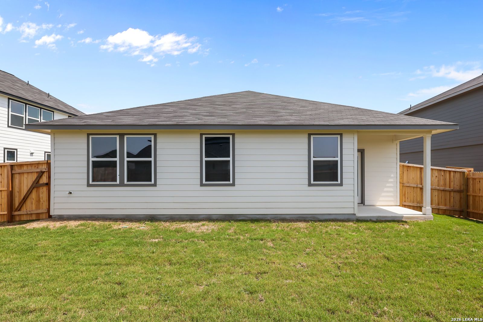 Back exterior view of The Daphne H floor plan by Davidson Homes with covered patio in Hannah Heights, Seguin, Texas.