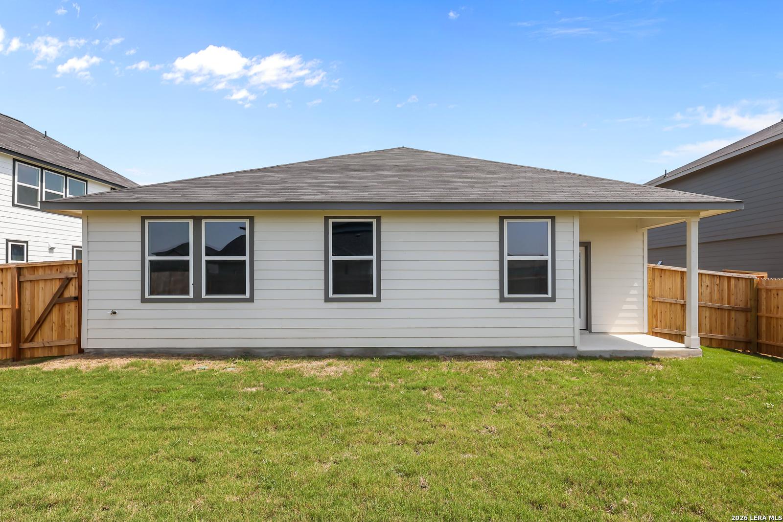 Back exterior view of The Daphne H floor plan by Davidson Homes with covered patio in Hannah Heights, Seguin, Texas.