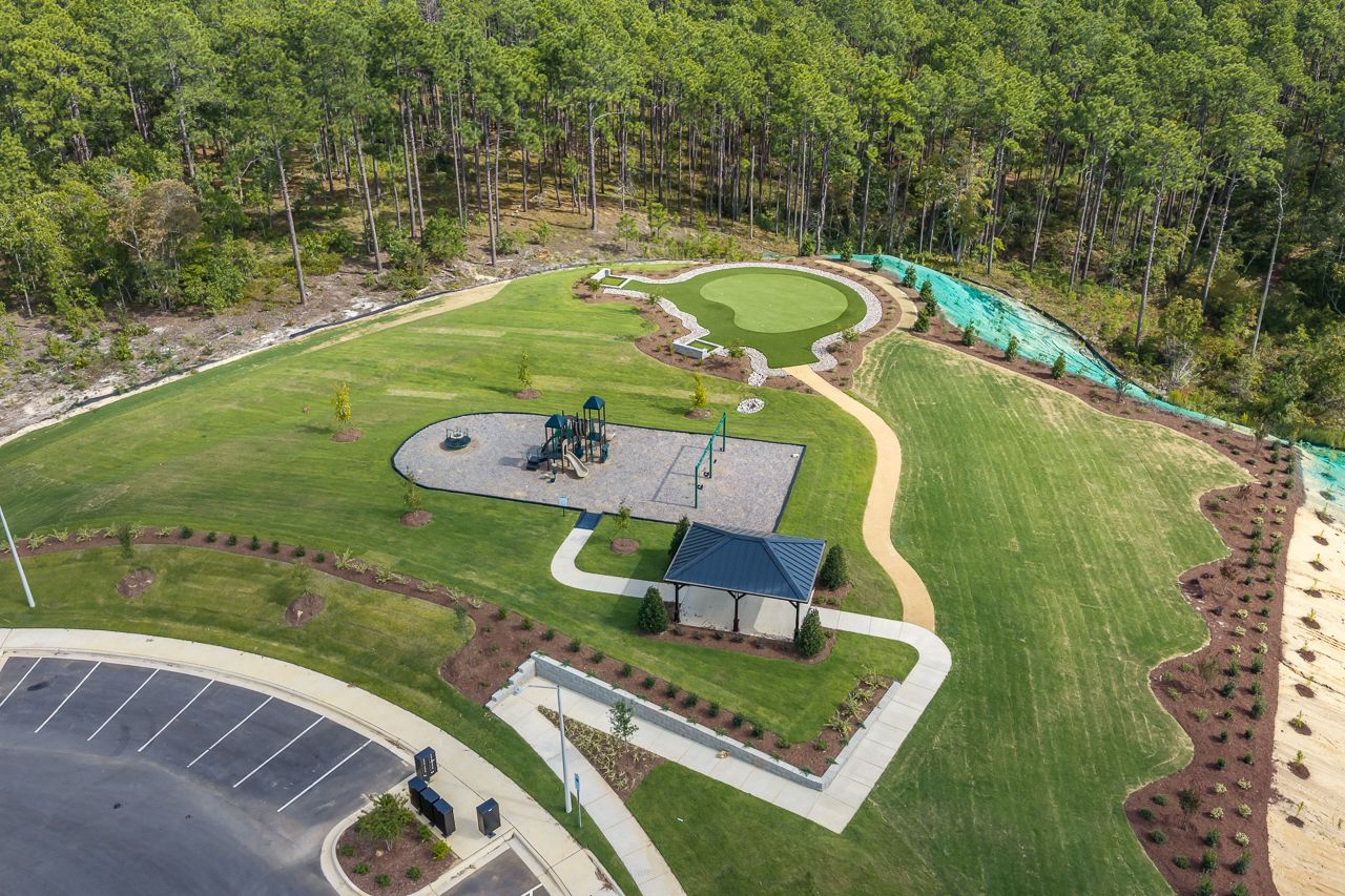 Aerial view of community park at Montrose in Aberdeen, NC with playground, pavilion, and putting green by Davidson Homes