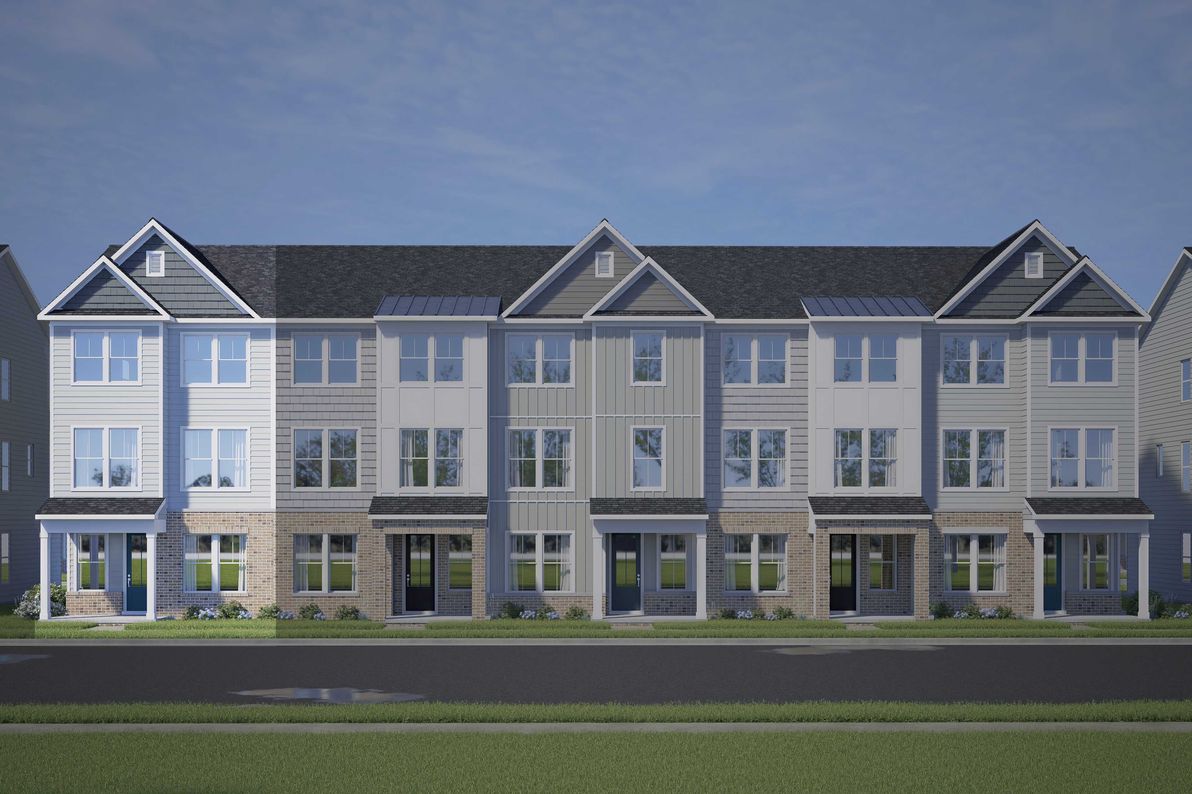 Modern three-story Avery townhomes by Davidson Homes in Knightdale, NC: white-gray siding, brick accents, front porches, two-car garages