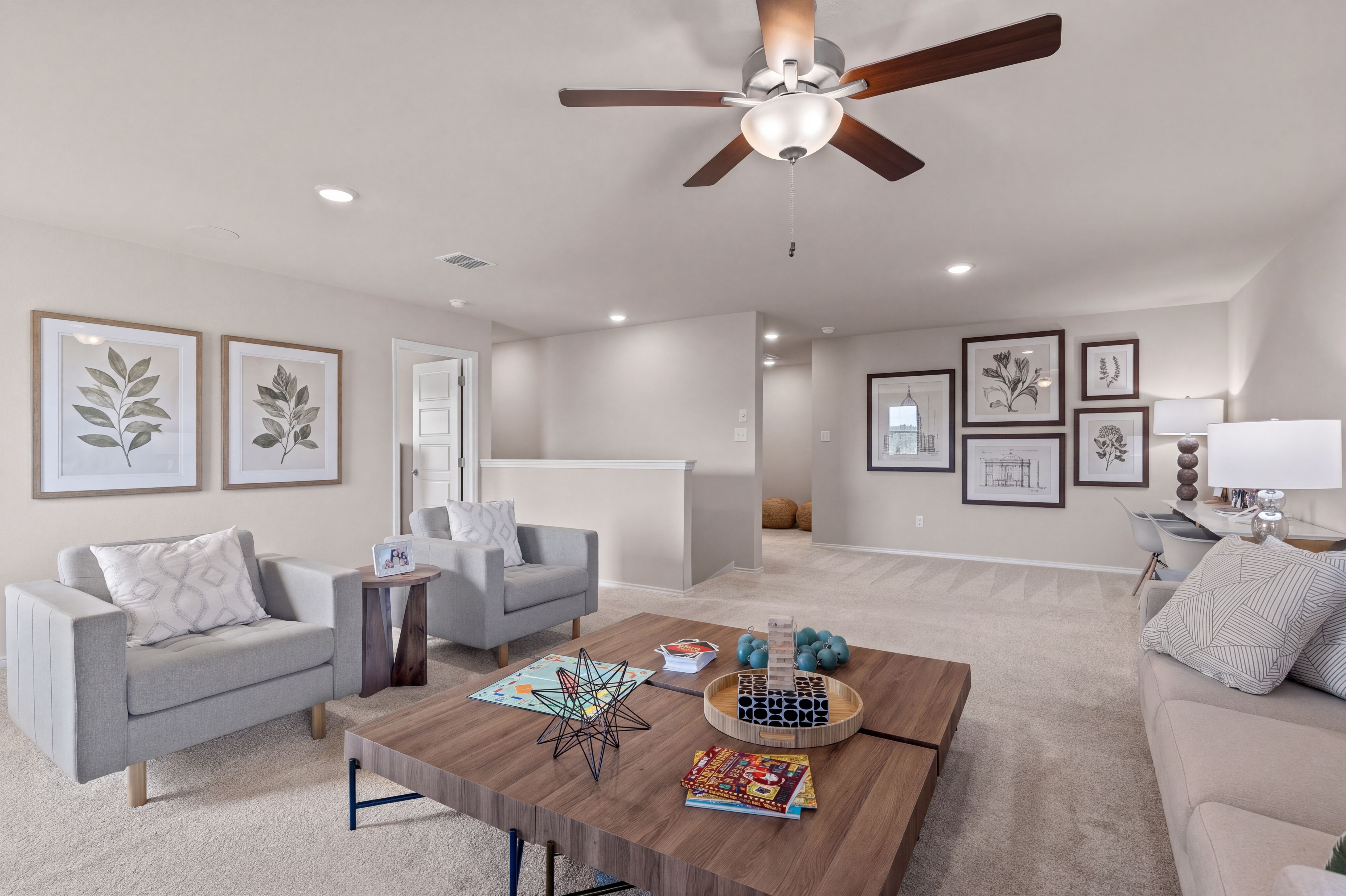 Open game room in the two-story model home located in San Antonio, TX
