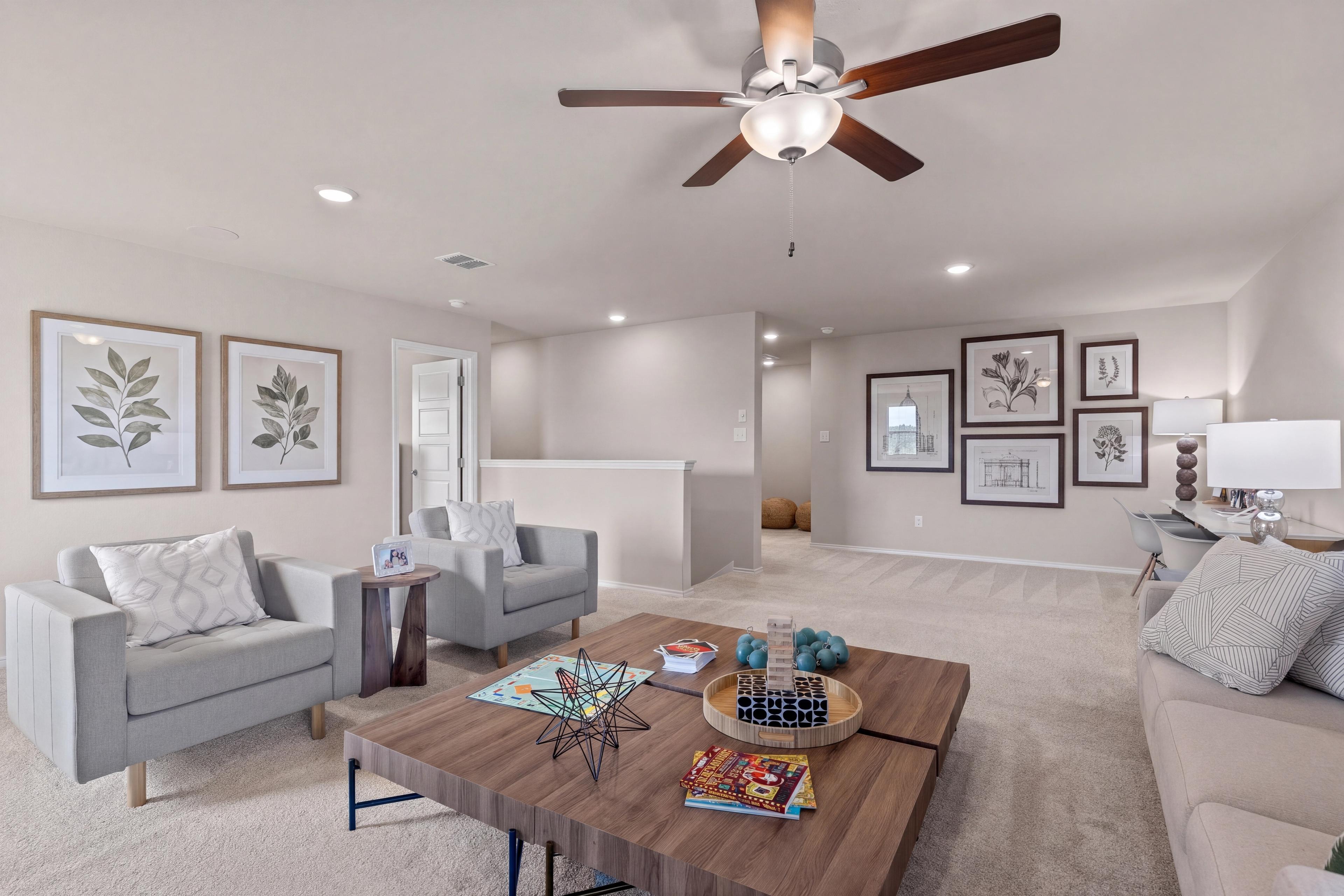 Open game room in the two-story model home located in San Antonio, TX