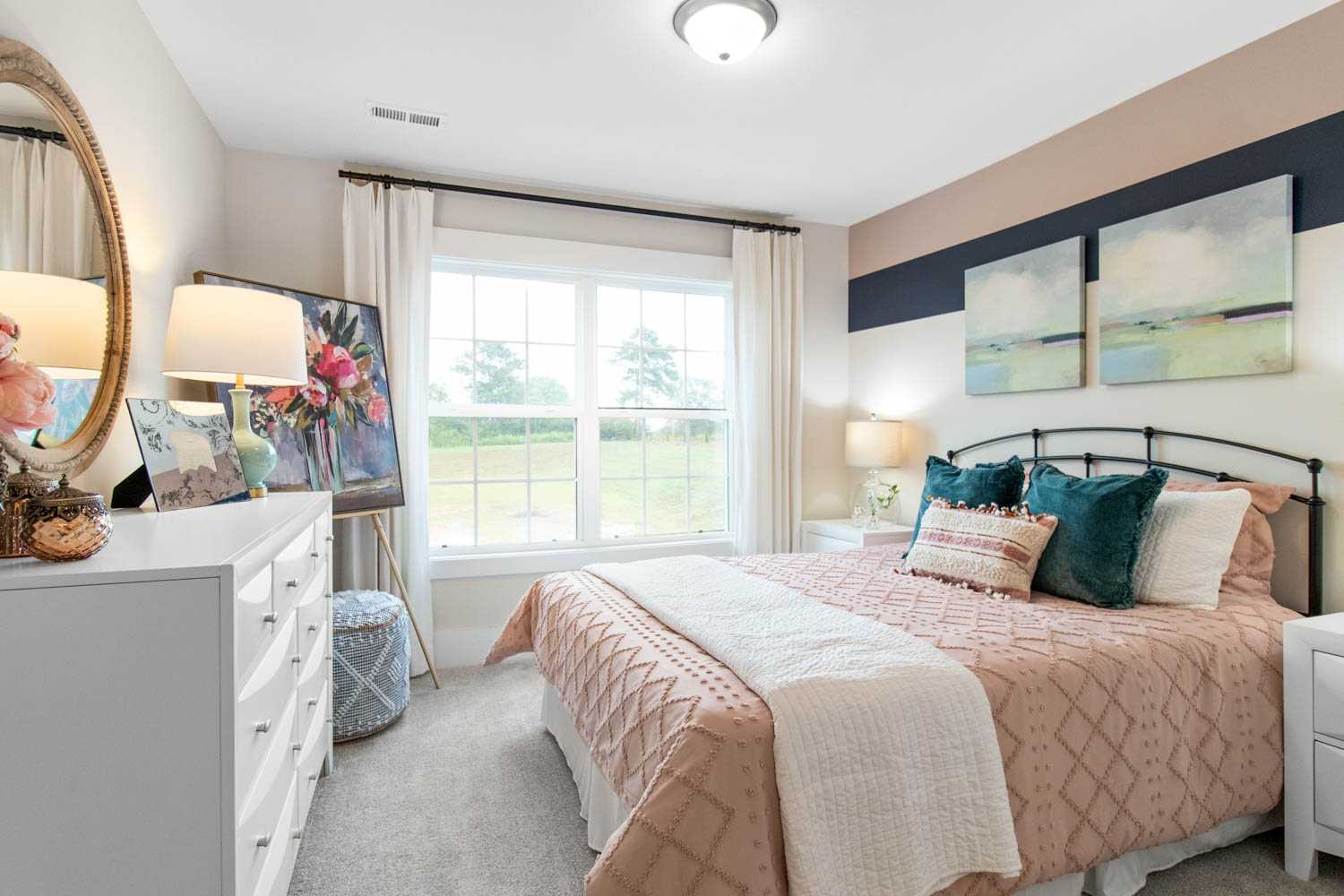 secondary bedroom with striped accent wall
