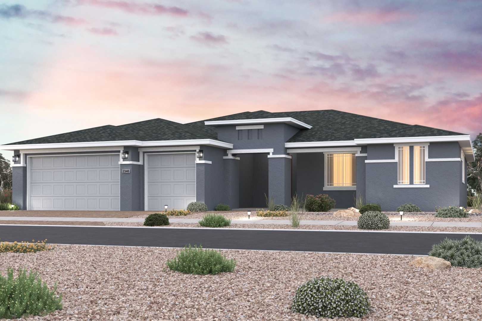 Contemporary gray modern home exterior in Westwood Prescott Arizona by Davidson Homes with two-car garage, desert shrubs, and sunset sky