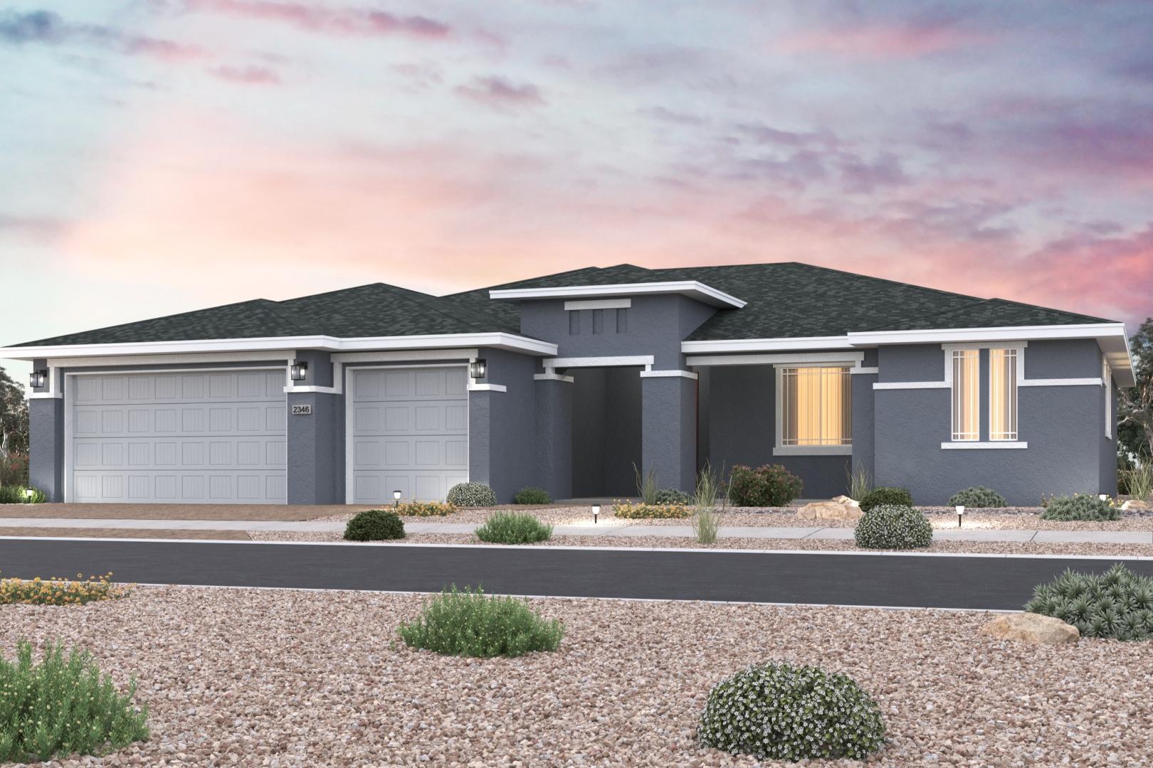 Contemporary gray modern home exterior in Westwood Prescott Arizona by Davidson Homes with two-car garage, desert shrubs, and sunset sky