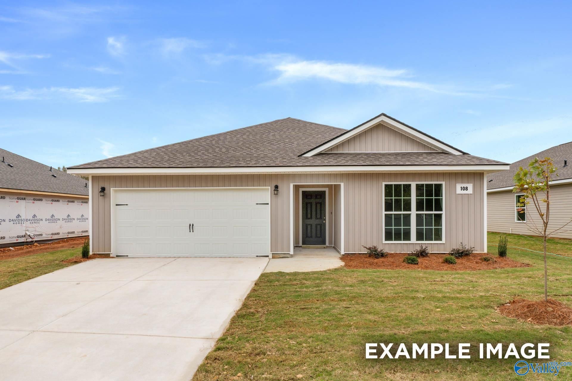 Modern one-story 3-bedroom home with 2-car garage, beige siding, and driveway in Chapel Hill, Athens, Alabama - Davidson Homes Franklin V