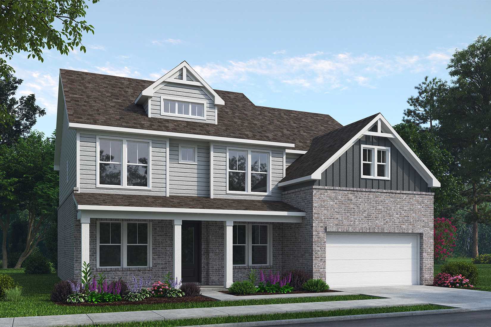 Two-story Danbury K home elevation by Davidson Homes: brick and gray siding exterior, front porch, two-car garage, lush landscaping in Buford, GA