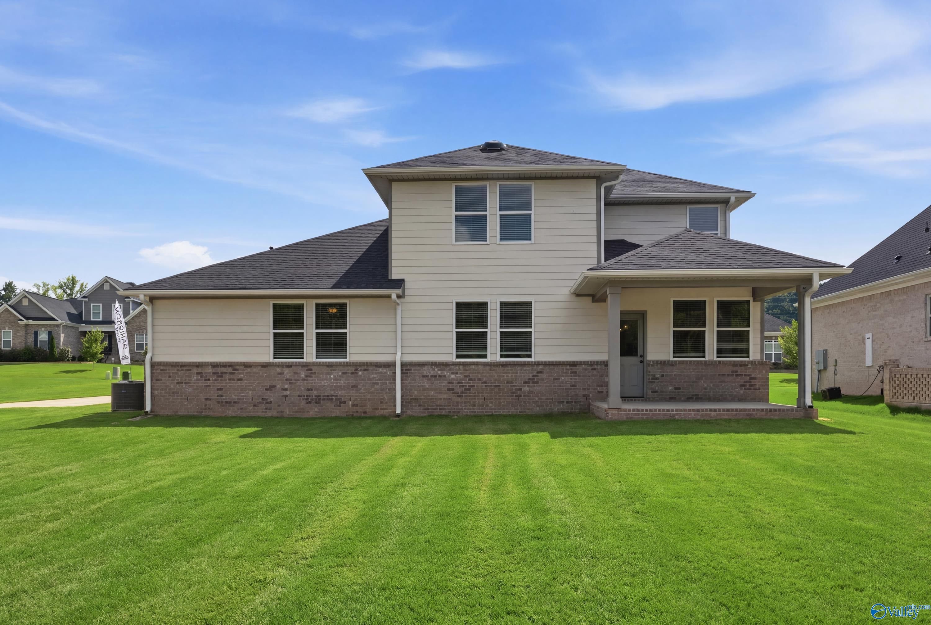 Rear exterior view of The Dorado floor plan by Davidson Homes featuring a covered patio in Riverton Preserve, Huntsville, AL.