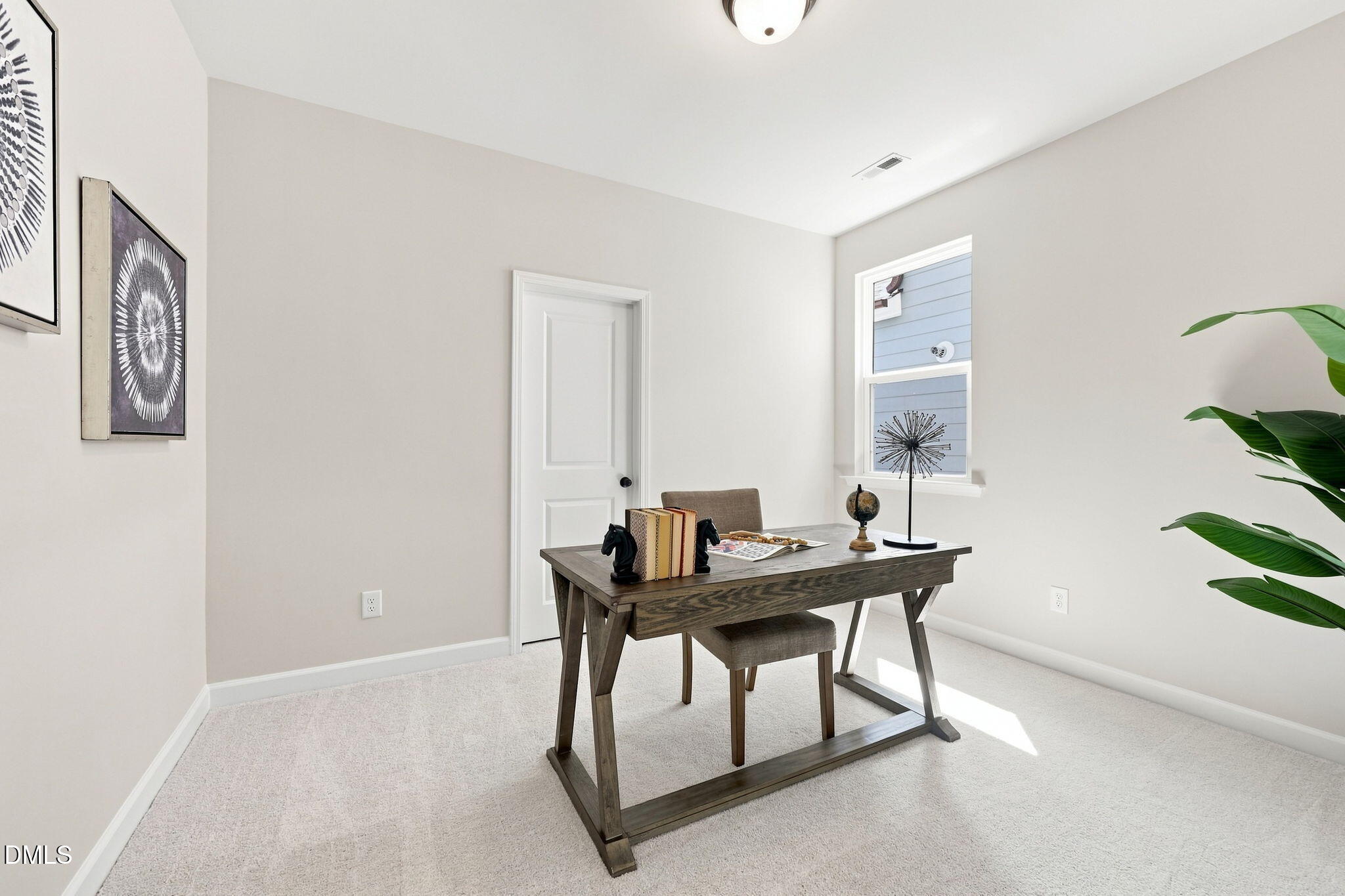 Bright home office with desk and decor in The Harris C floor plan by Davidson Homes in Forestville Yard, Knightdale, NC.