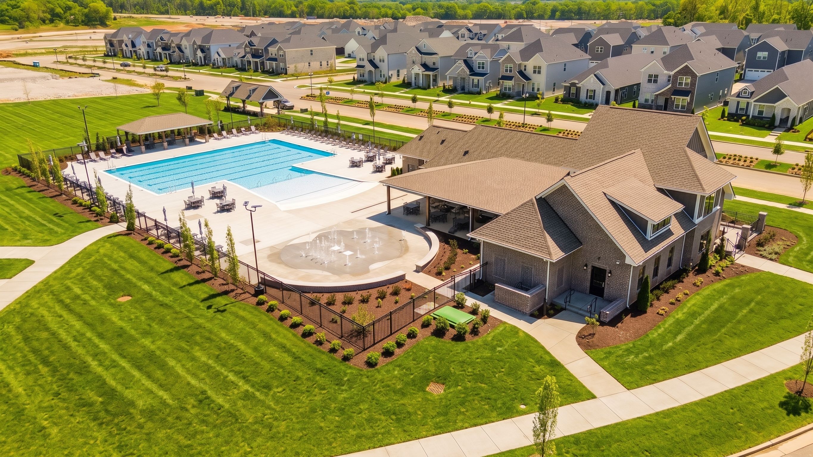 Community pool, splash pad, and clubhouse at Bradshaw Farms in Mt. Juliet, TN, built by Davidson Homes.
