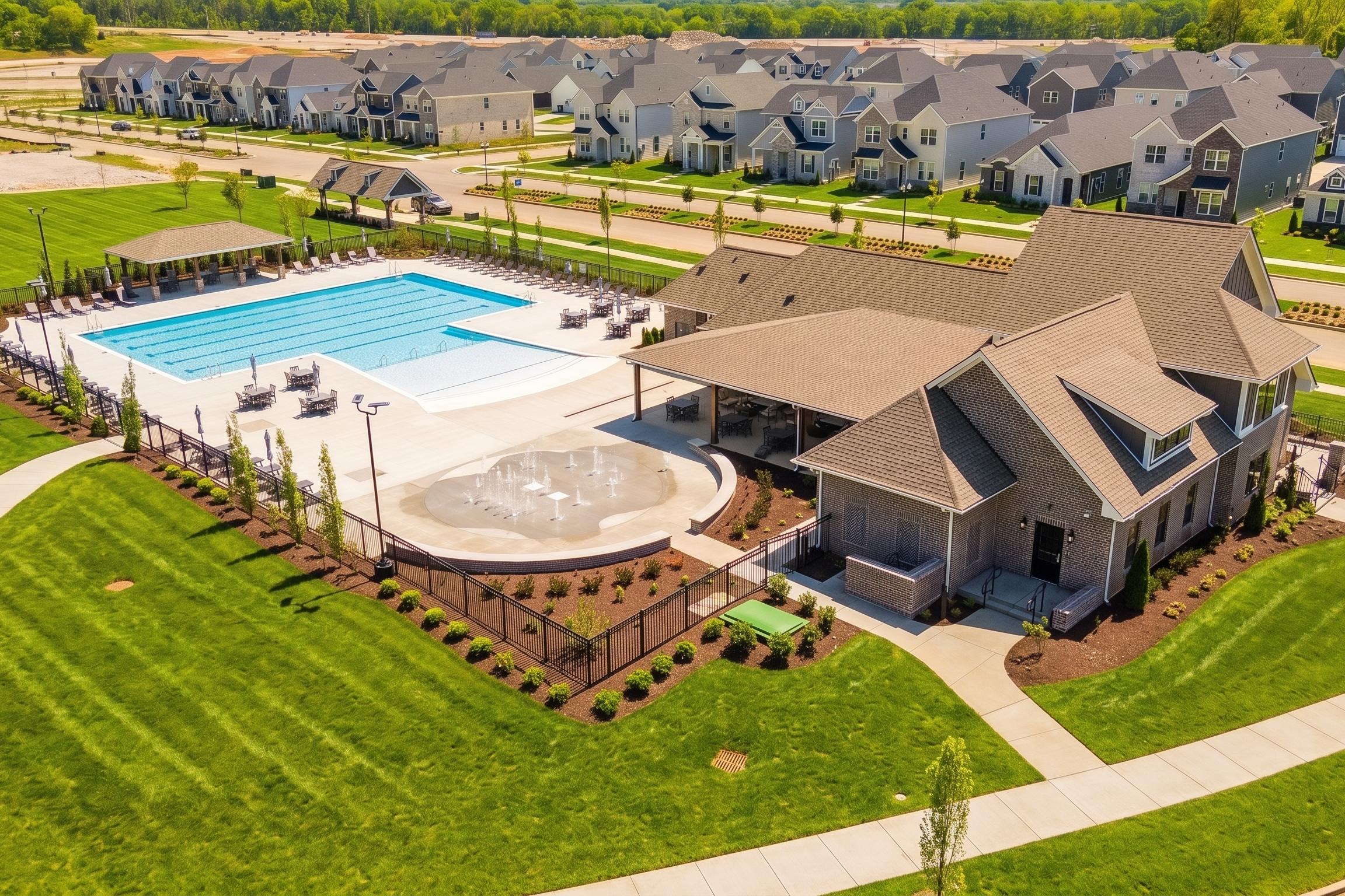 Community pool, splash pad, and clubhouse at Bradshaw Farms in Mt. Juliet, TN, built by Davidson Homes.