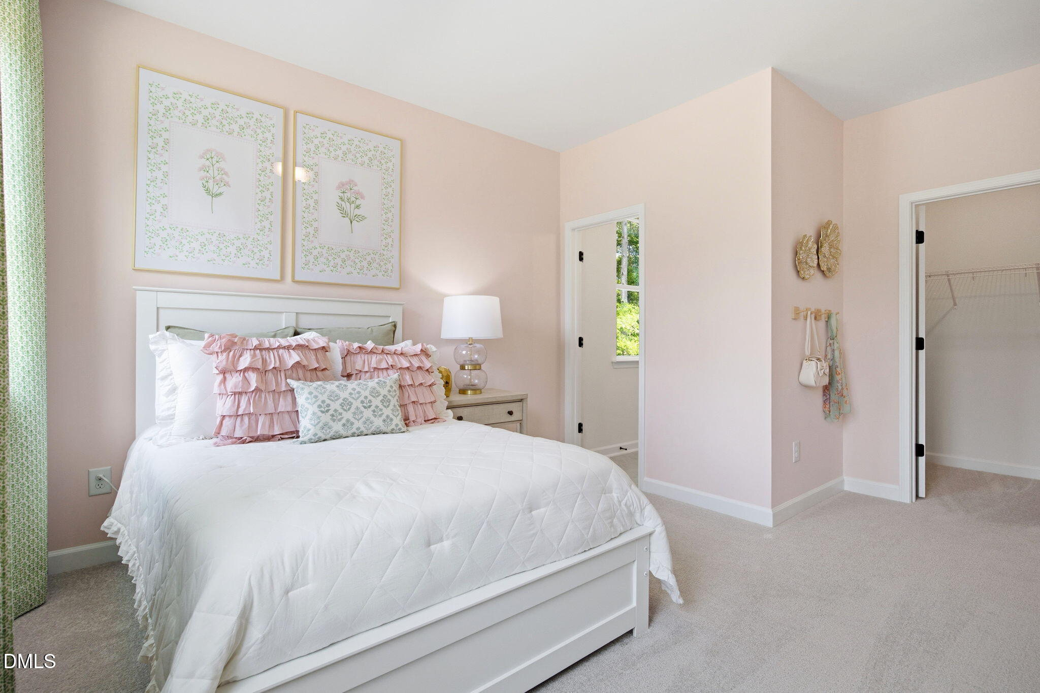 Cozy secondary bedroom with pink walls and walk-in closet in The Ashport M floor plan at Wendell Ridge, Wendell, NC.