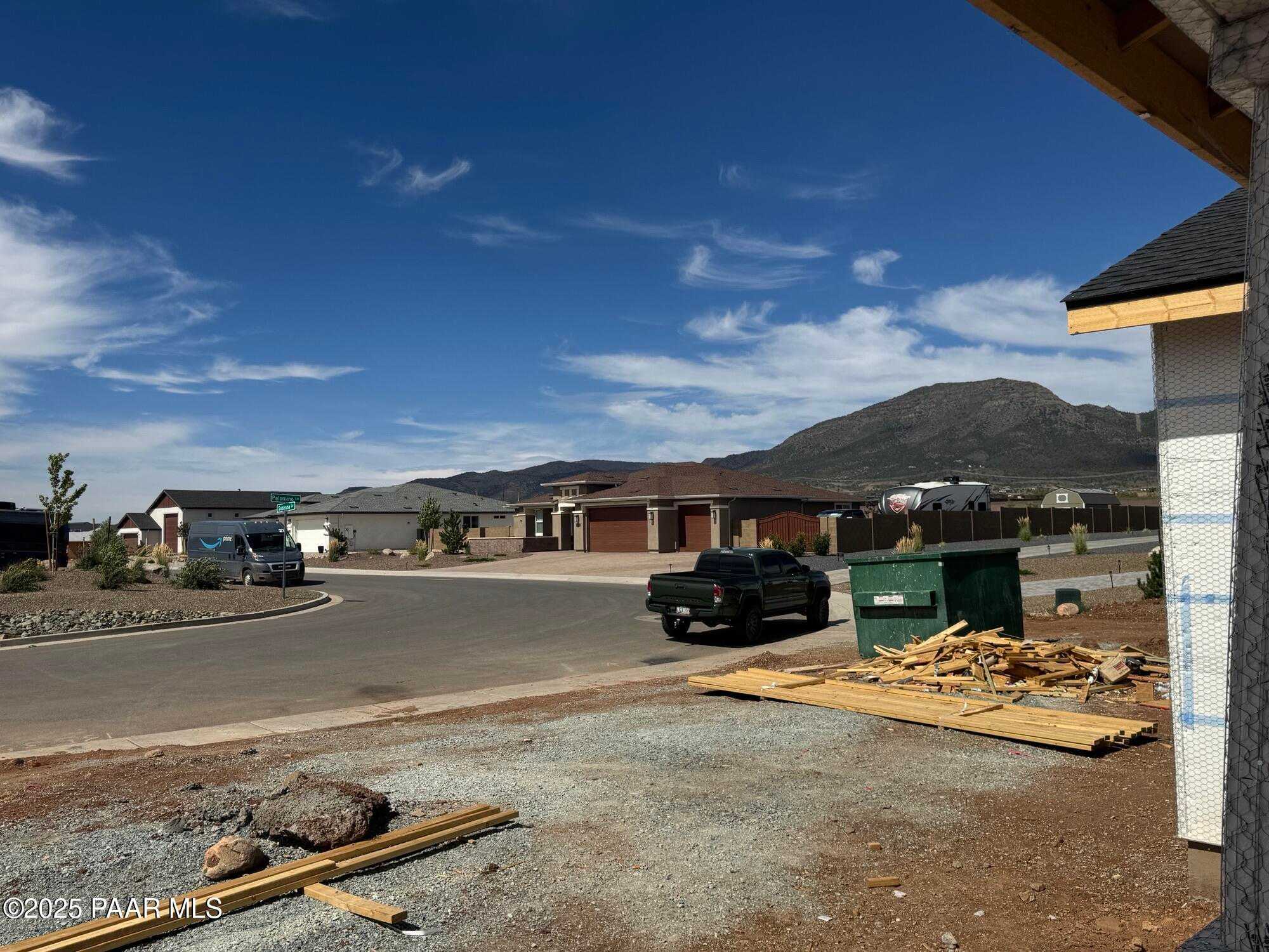 Under-construction 3-bed, 3-bath Sunrise A home with 4-car garage framing, mountain views in Morningstar, Prescott Valley, AZ