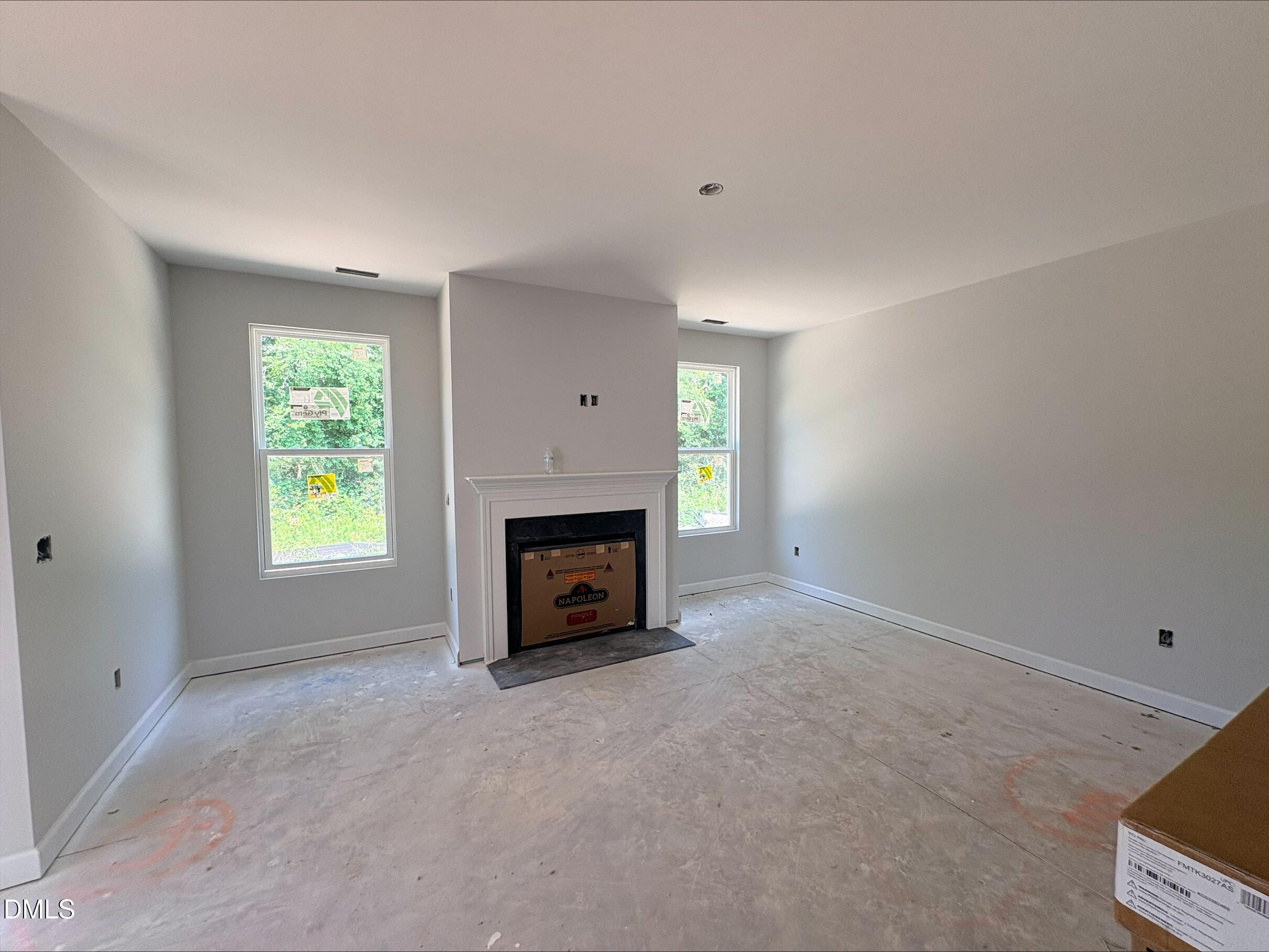 Living room with fireplace in The Daphne D floor plan at Woodland Crossing, Zebulon, North Carolina by Davidson Homes.