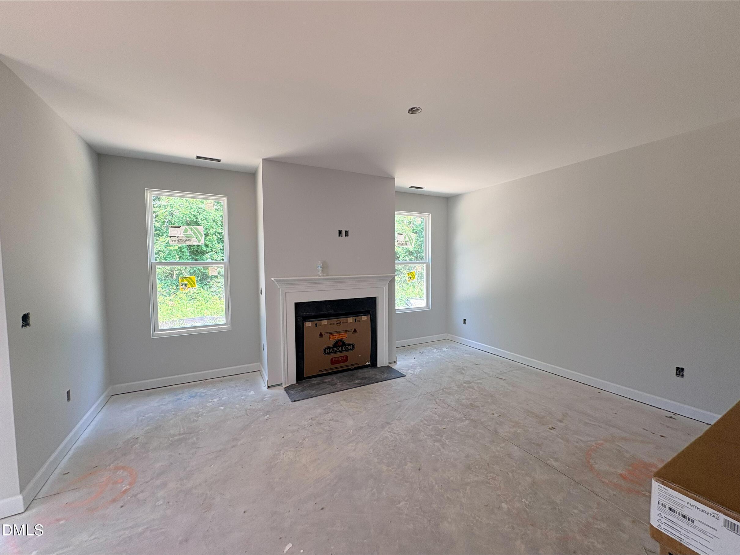 Living room with fireplace in The Daphne D floor plan at Woodland Crossing, Zebulon, North Carolina by Davidson Homes.