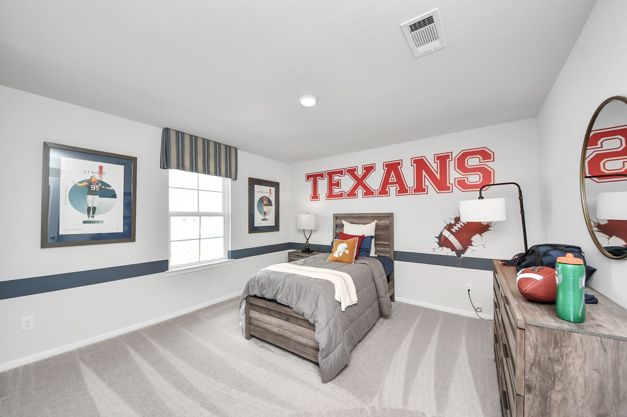 Houston Texans themed bedroom in a Davidson Homes house at Sunterra in Katy, Texas, featuring a twin bed and decor.