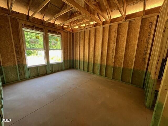 Framed bedroom interior with exposed wooden studs and vaulted ceiling in The Franklin C floor plan, Wellers Knoll home.