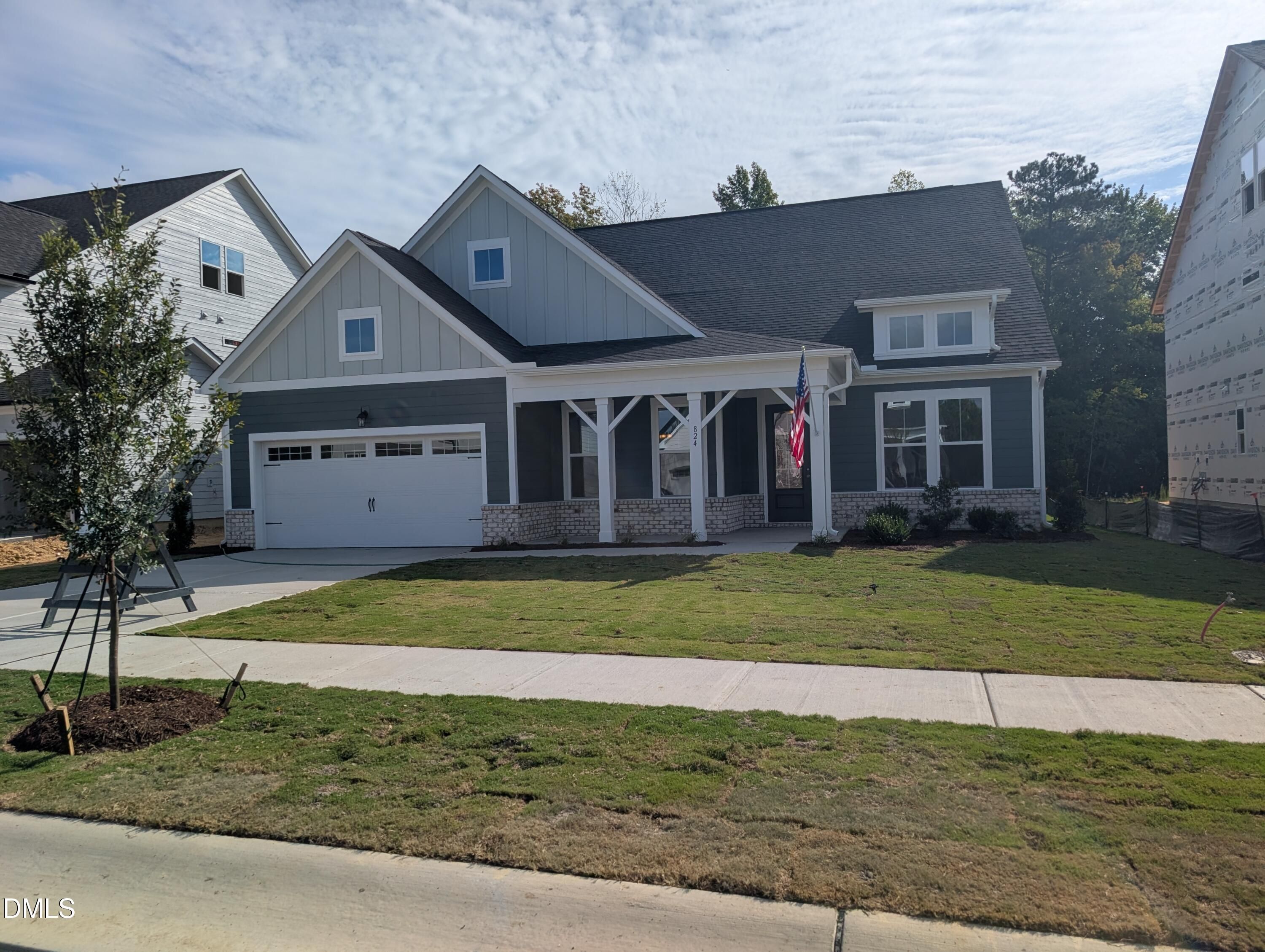 Gray two-story Davidson Homes Magnolia A with covered porch and 2-car garage in Wendell Ridge, Wendell, North Carolina