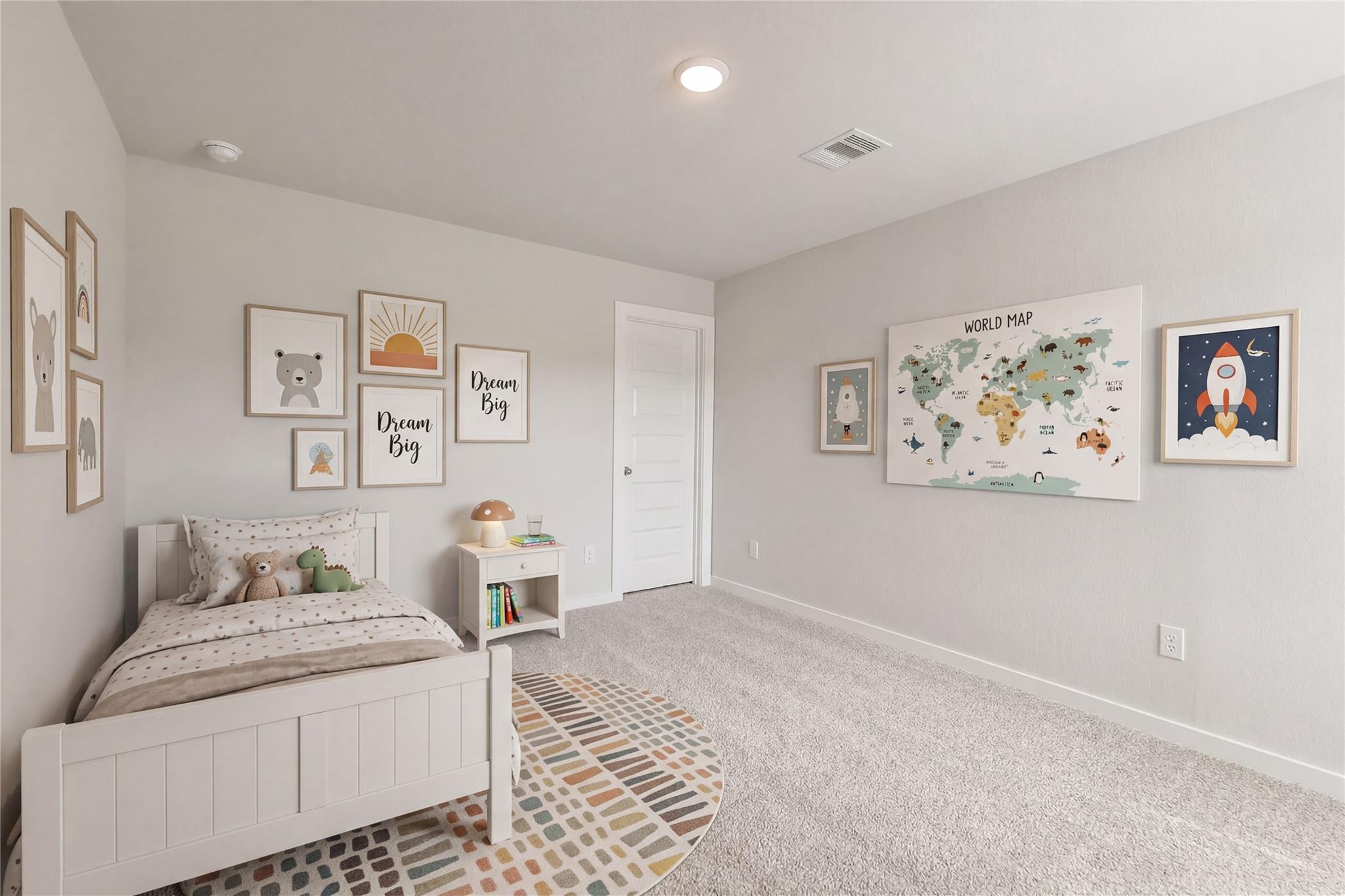 Cozy children's bedroom with white twin bed, stuffed bear and dinosaur toys, world map wall art, and patterned rug in Davidson Homes San Marcos E, Conroe TX