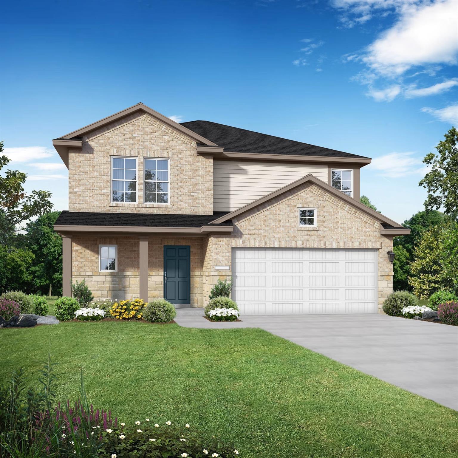 Two-story brick home with 2-car garage, blue front door, and lush landscaped yard in Emberly, Beasley, Texas - Davidson Homes Tierra B