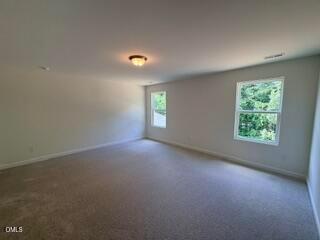 Spacious carpeted loft in The Willow B floor plan at Woodland Crossing, Zebulon, North Carolina.
