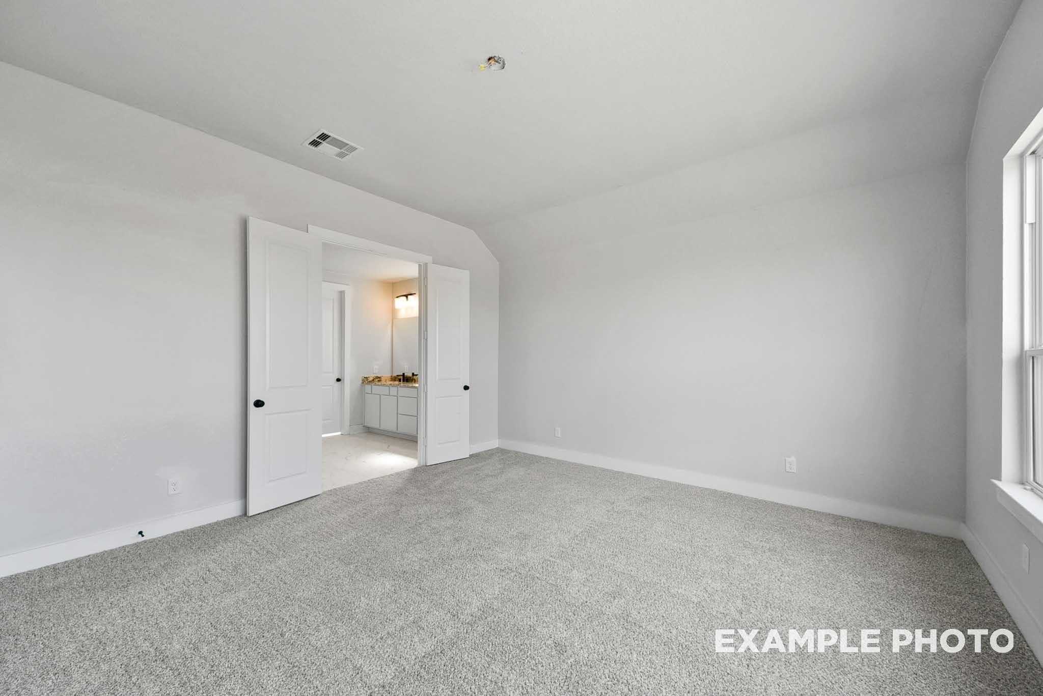 Spacious master bedroom with double doors to en-suite bath in Davidson Homes The George A, Lago Mar, Texas City