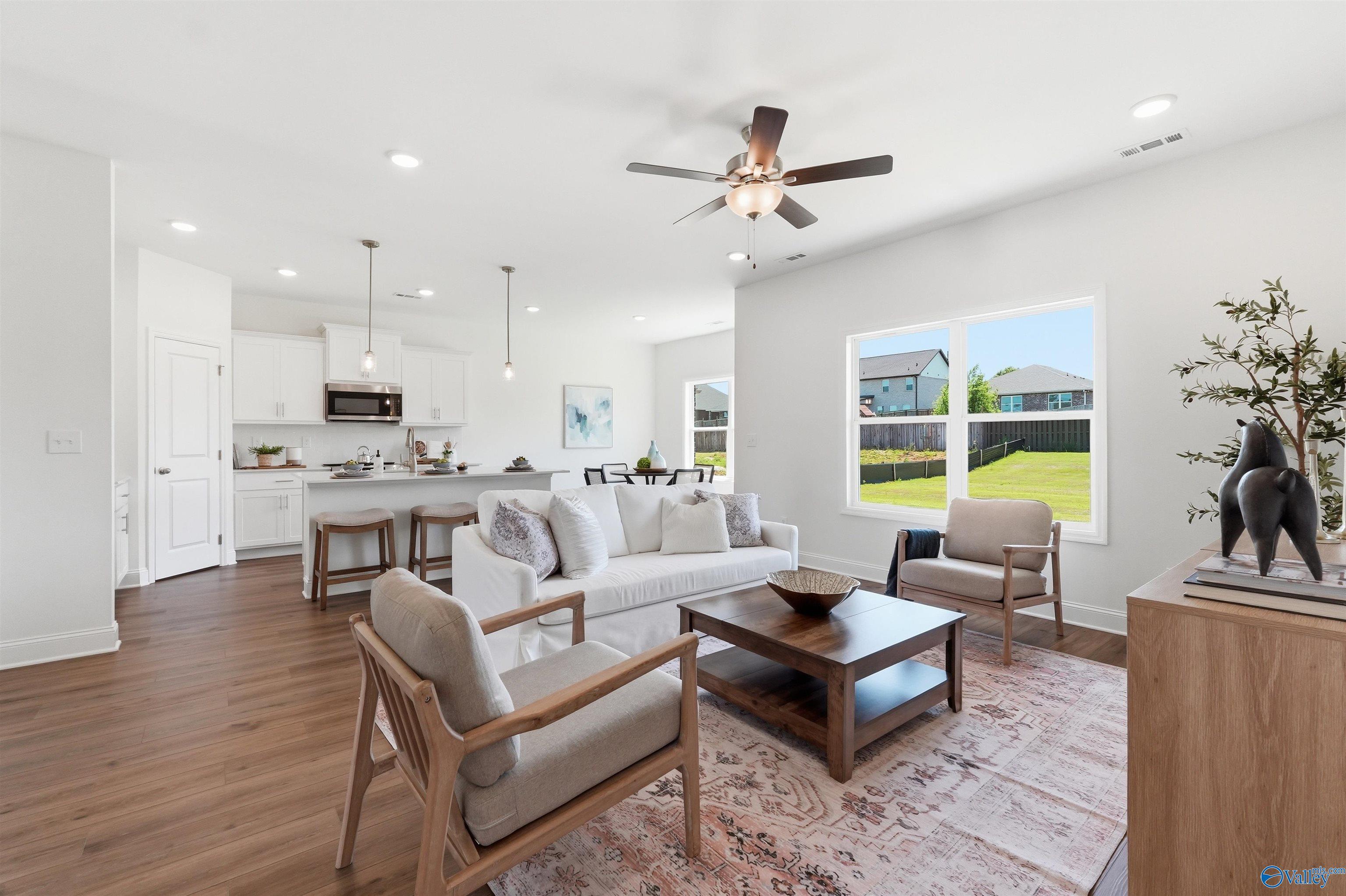 Open-concept living room and kitchen in The Franklin C floor plan by Davidson Homes, Lynn Meadows, Meridianville, Alabama.