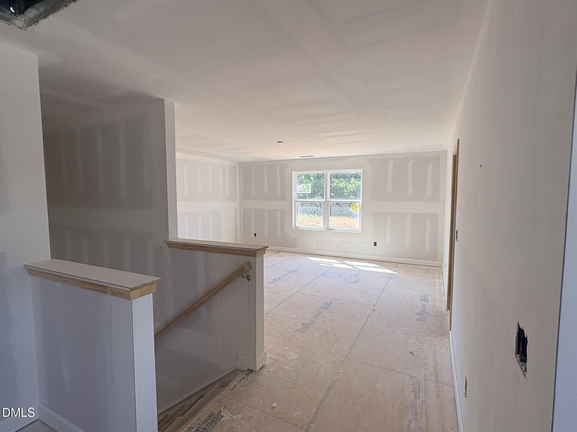 Spacious unfinished loft area in The Ash C floor plan at Woodland Crossing, Zebulon, North Carolina.