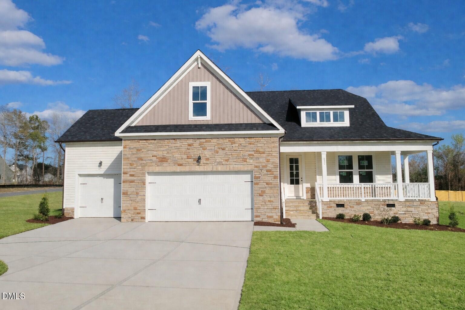 Davidson Homes Cypress B II: 2-story brick & siding home with 3-car garage, gabled roof, front porch in Tobacco Road, Angier, NC