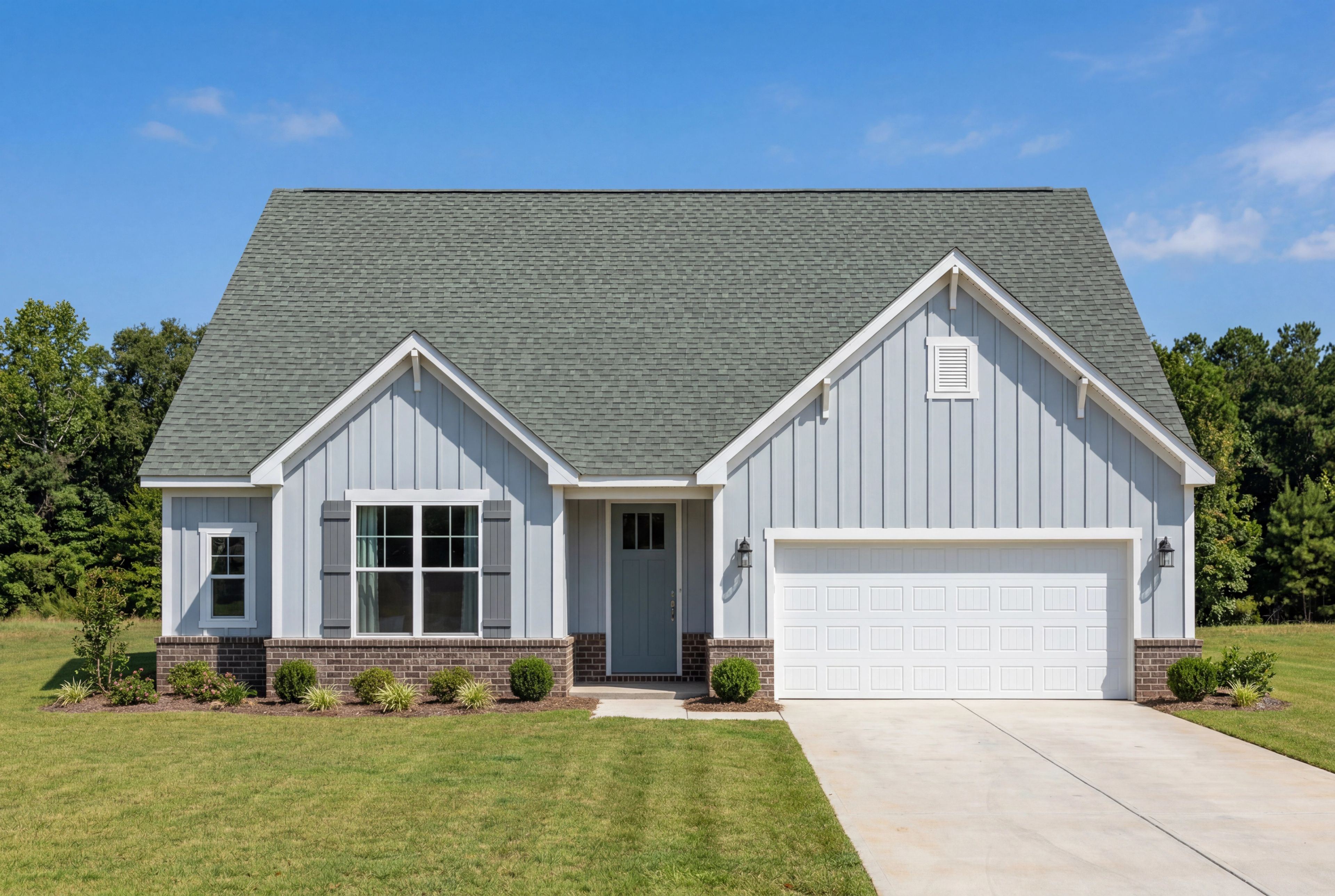 The Montgomery by Davidson Homes featuring a 1-story, 2-car garage design with light blue siding and brick accents.