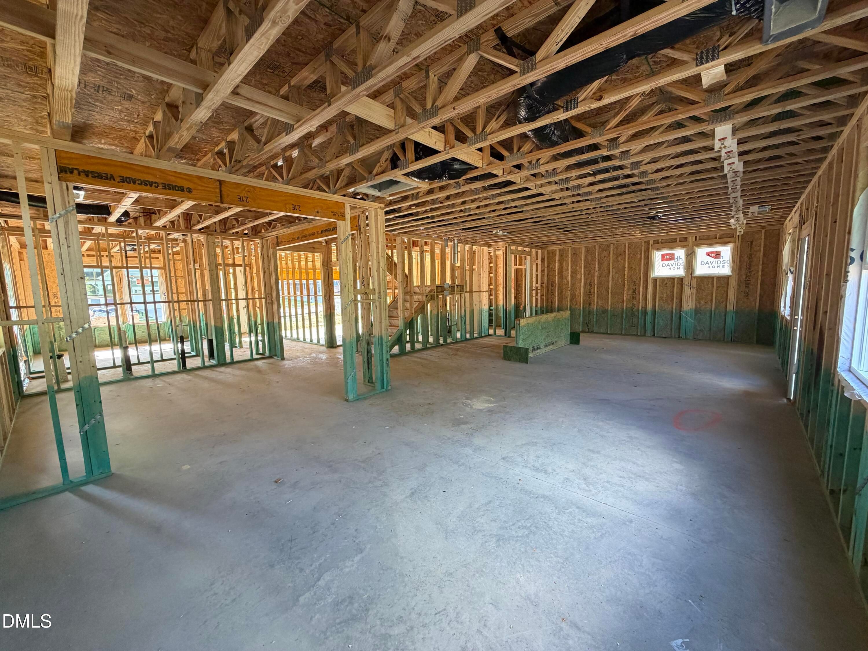 Open-concept main floor under construction with wood framing and truss ceilings in Davidson Homes The Beech plan, Wendell Ridge, NC