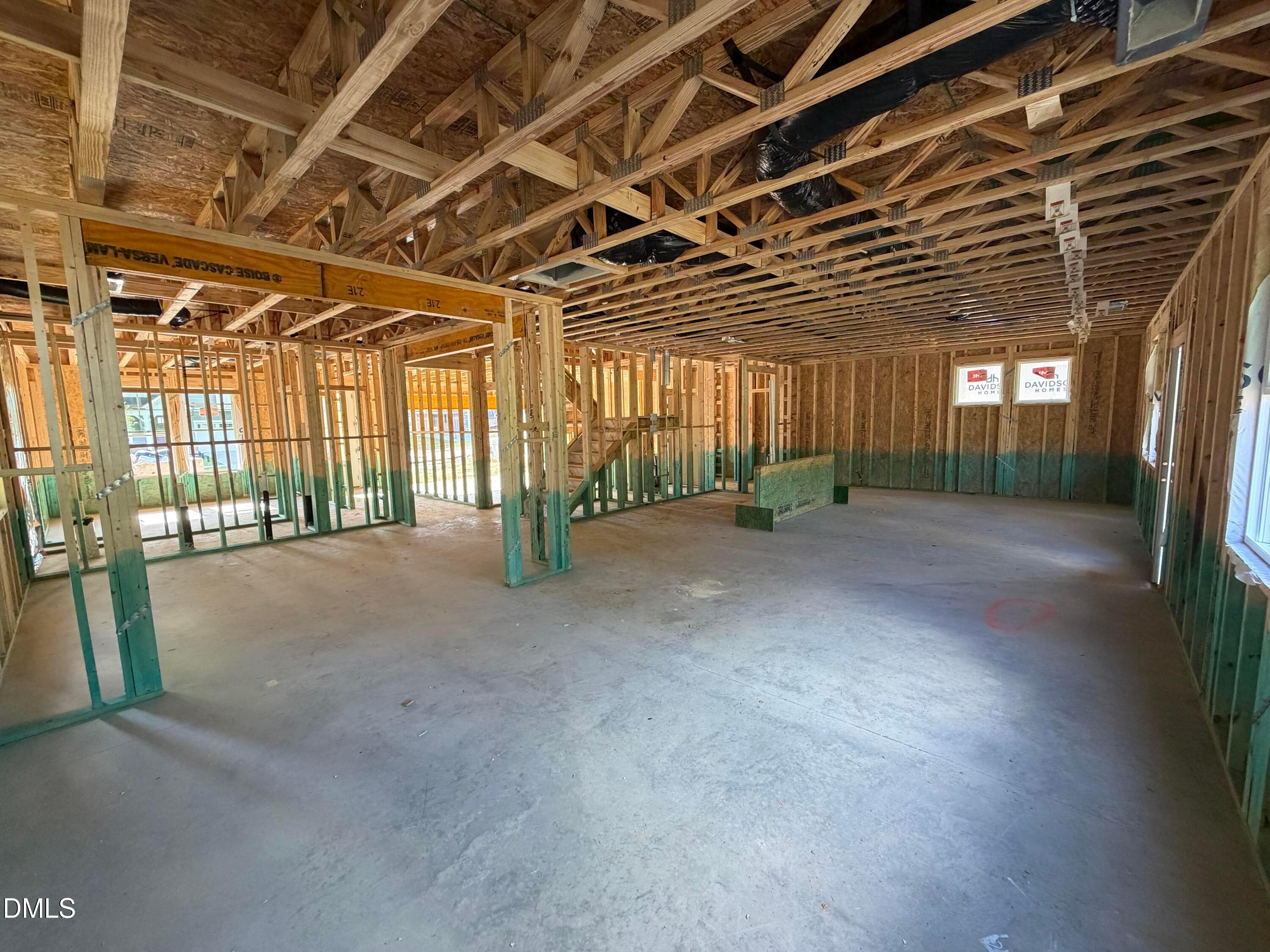 Open-concept main floor under construction with wood framing and truss ceilings in Davidson Homes The Beech plan, Wendell Ridge, NC