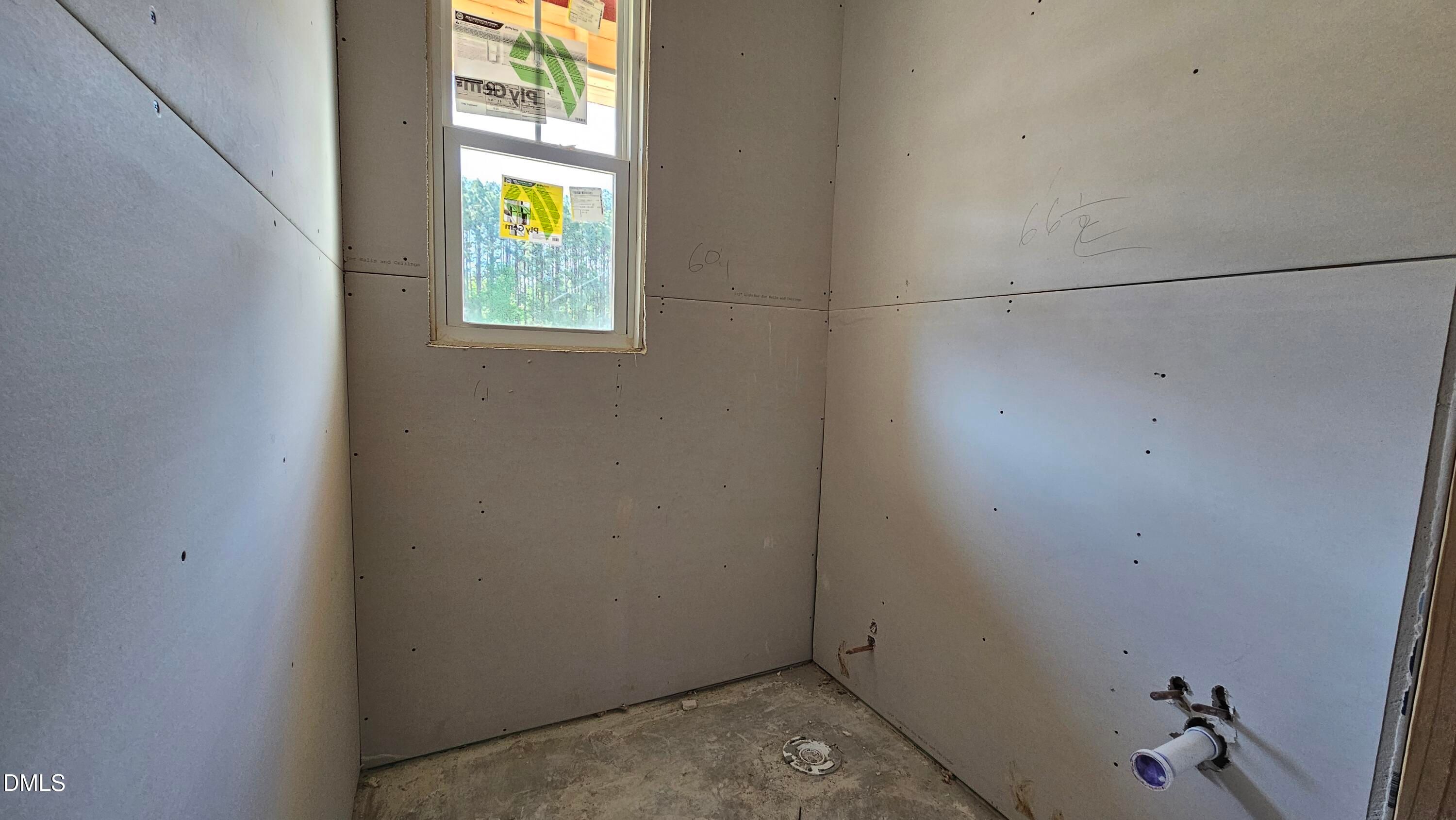 Unfinished bathroom with drywall and plumbing in The Graham Interior floor plan at Springvale, Fuquay-Varina, North Carolina.