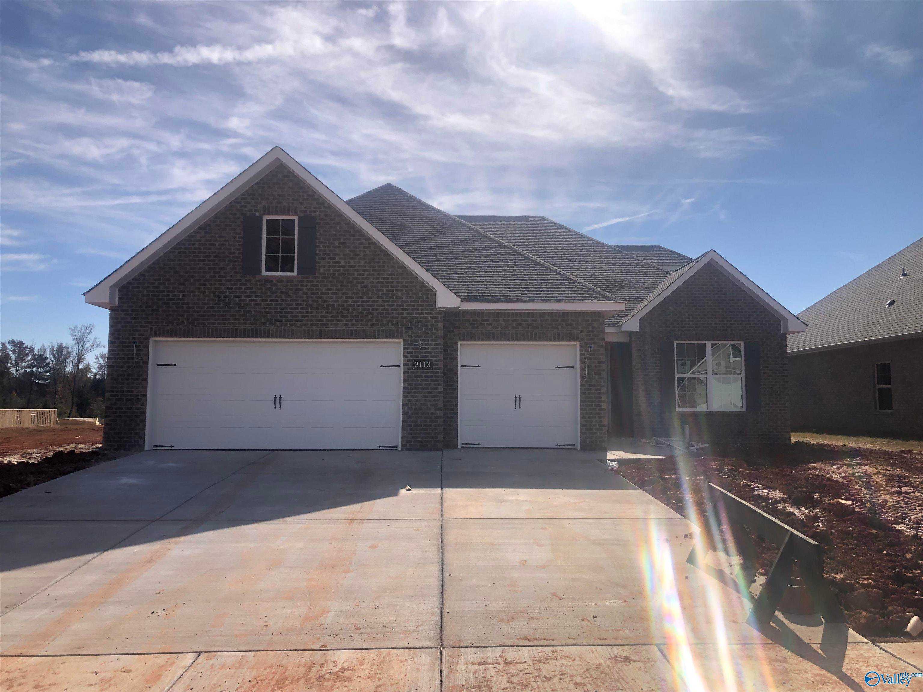 Brick 1-story home with 2-car garage, gabled roof, and white shutters in River Road Estates, Decatur, Alabama - Davidson Homes The Kirkland