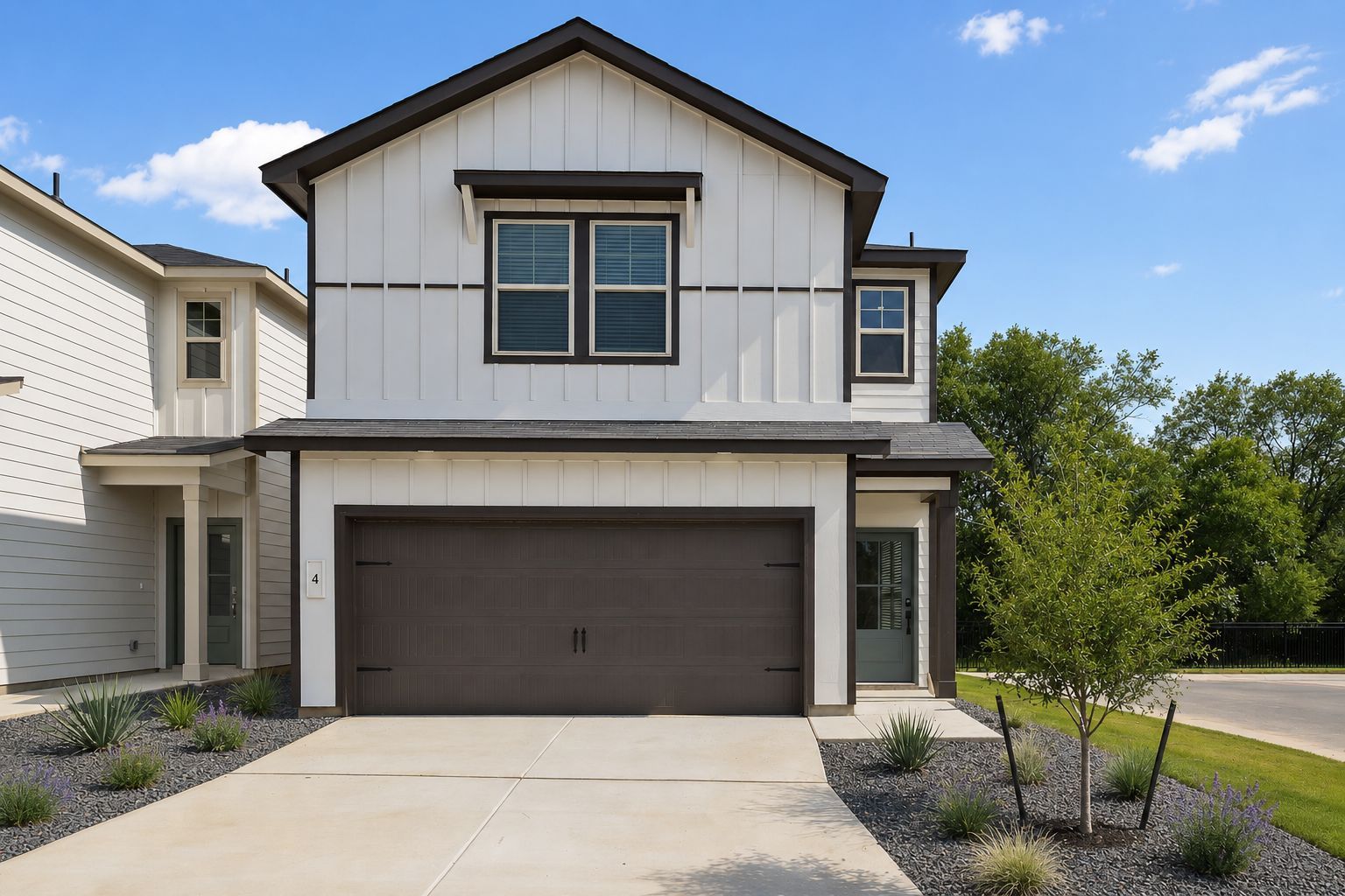 Modern farmhouse exterior by Davidson Homes at Cedar Heights in San Antonio, Texas with a spacious two-car garage.