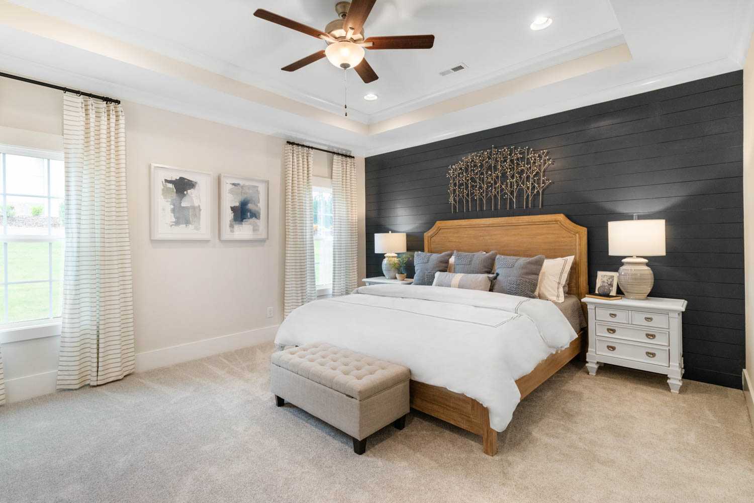 owner's suite with feature wall