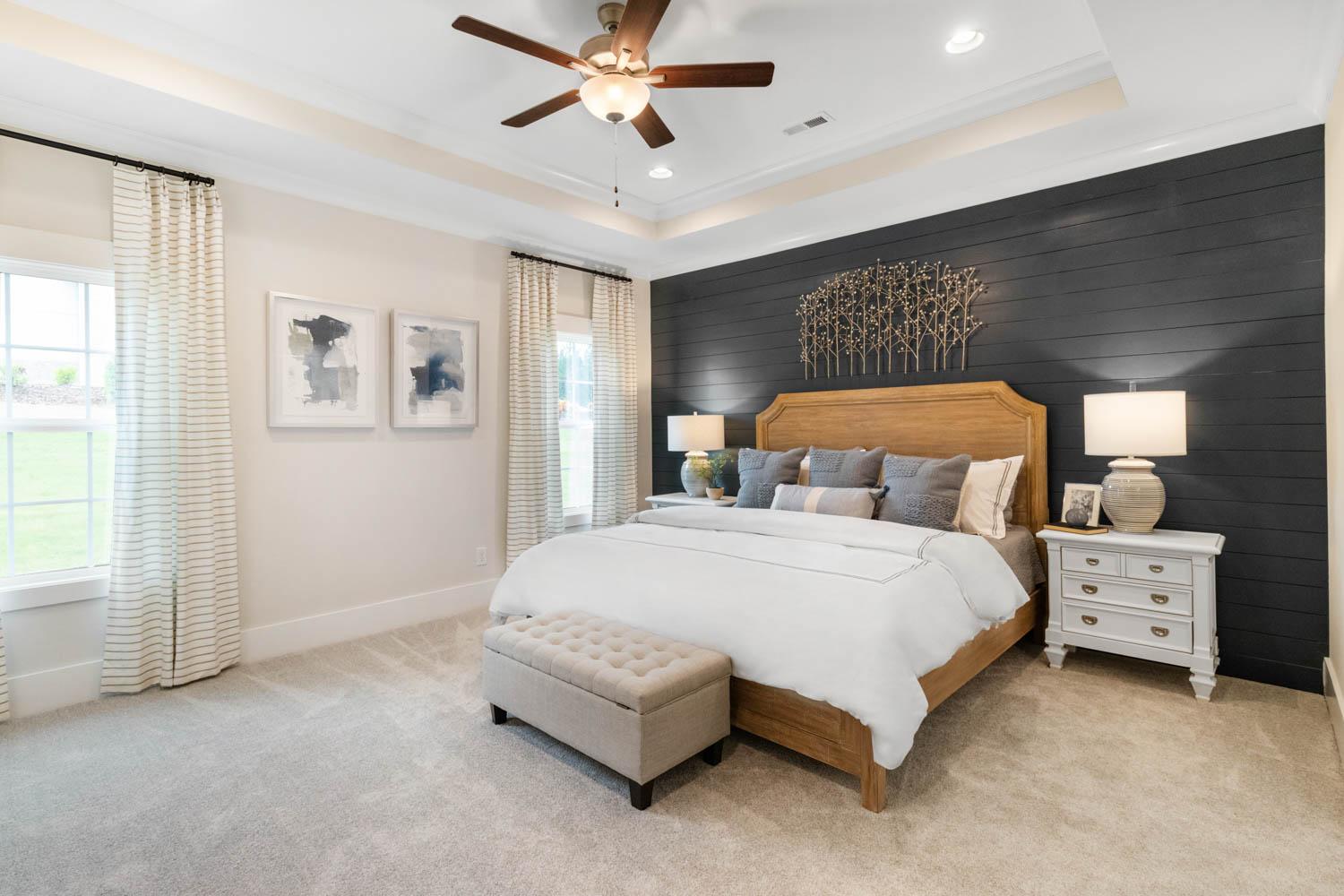 owner's suite with feature wall