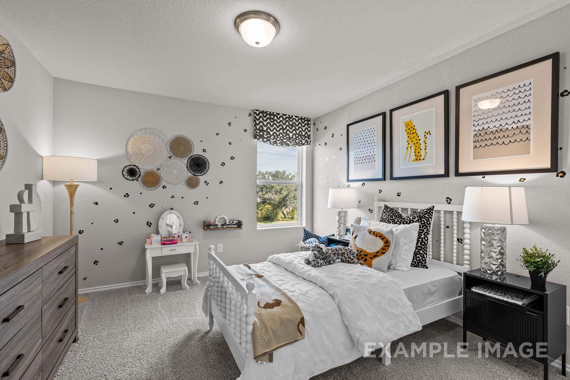 Leopard-themed child's bedroom with tufted white bed, vanity, woven baskets, and cheetah decor in Davidson Homes Sabine J, Heartland, Texas