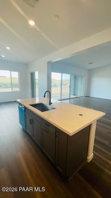 Modern kitchen island with quartz countertops in The Aurea C floor plan at Hidden Hills, Prescott, Arizona.