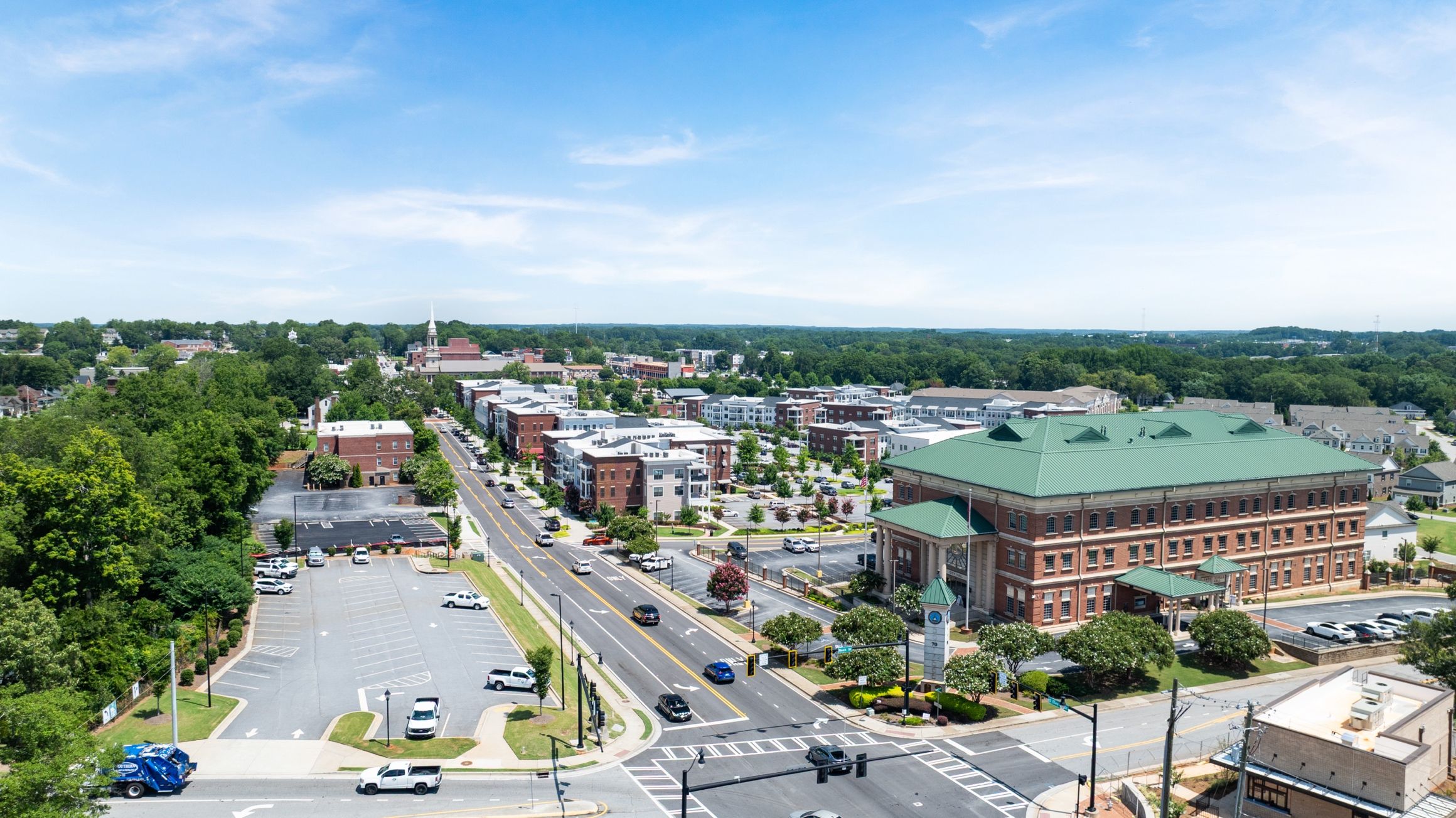 Aerial view of downtown Lawrenceville, Georgia near Alford at Bethesda, showing brick buildings, tree-lined streets, and courthouse