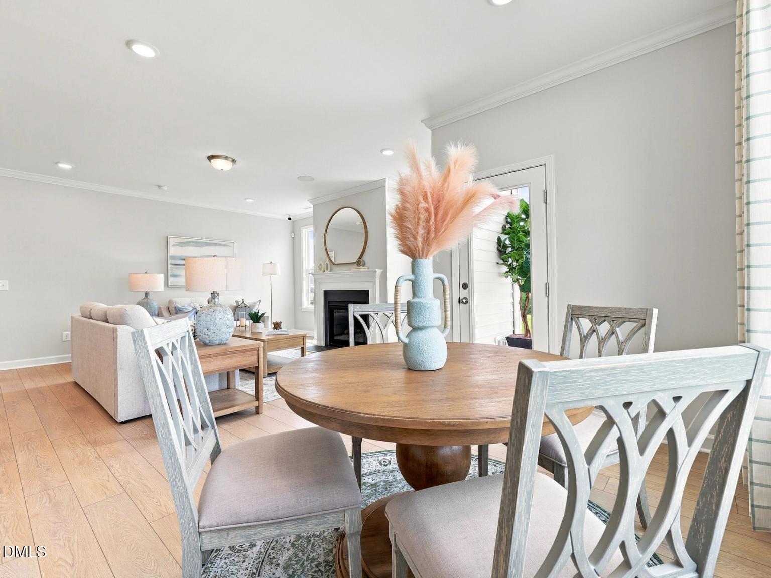Open-concept dining area and living room in The Daphne C floor plan at Woodland Crossing, Zebulon, North Carolina.