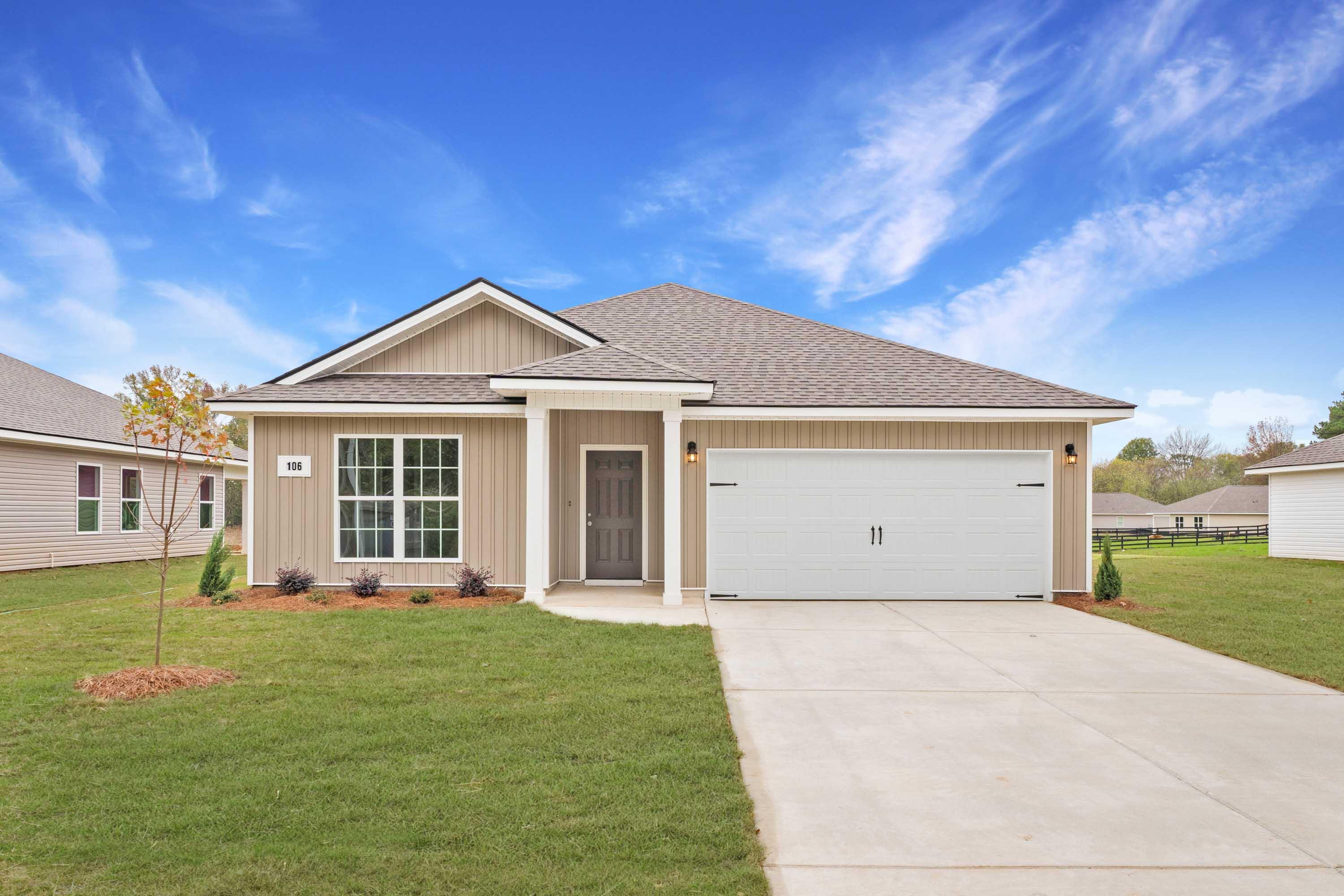 Modern Craftsman-style home exterior at Chapel Hill in Athens Alabama with covered porch, garage, and landscaped yard