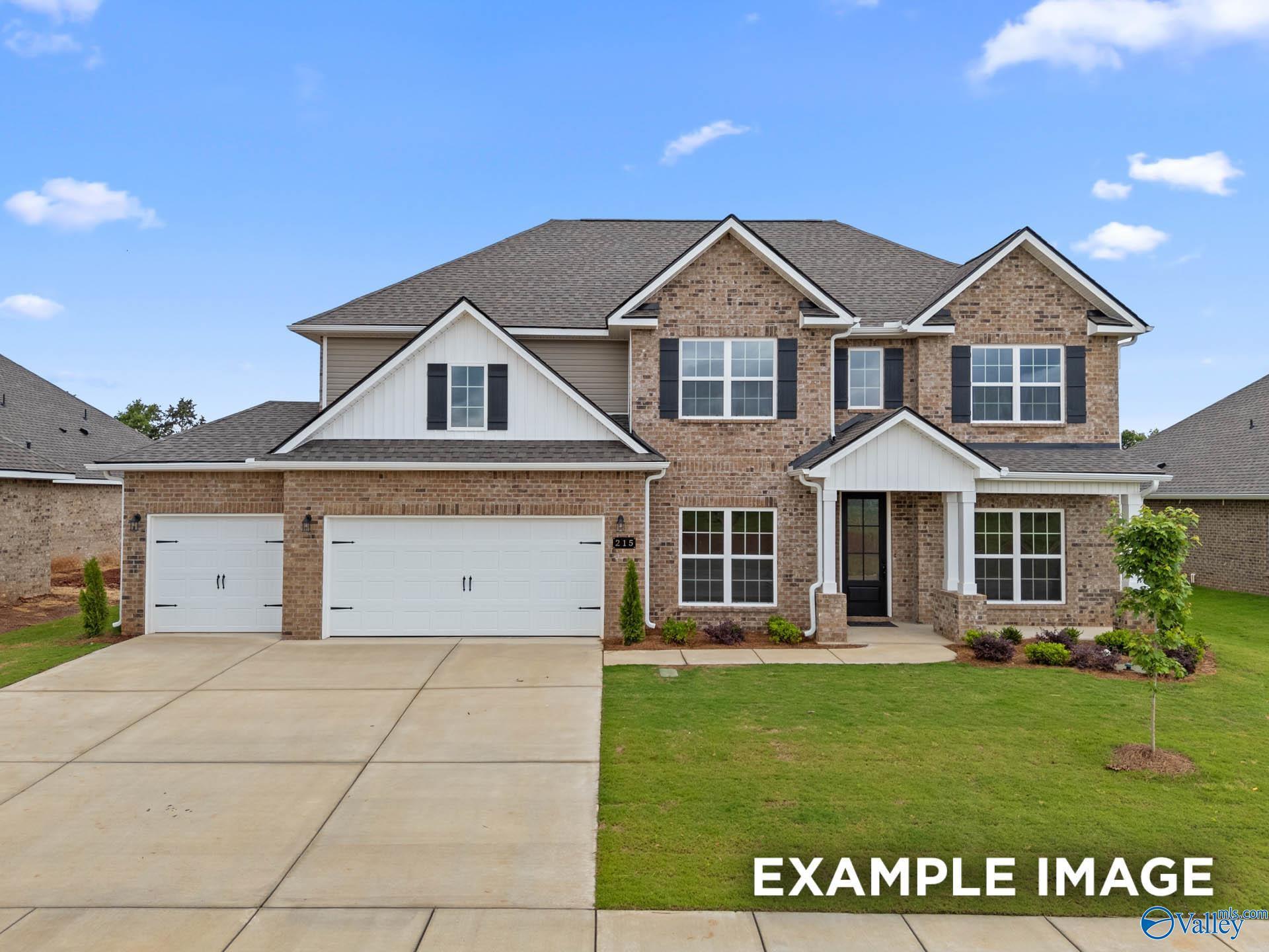 Modern brick exterior of Davidson Homes The Madison A 5-bedroom ranch with 3-car garage in Kendall Farms, Toney, Alabama